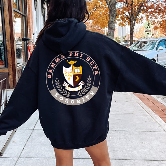 a woman walking down a sidewalk with a hoodie on