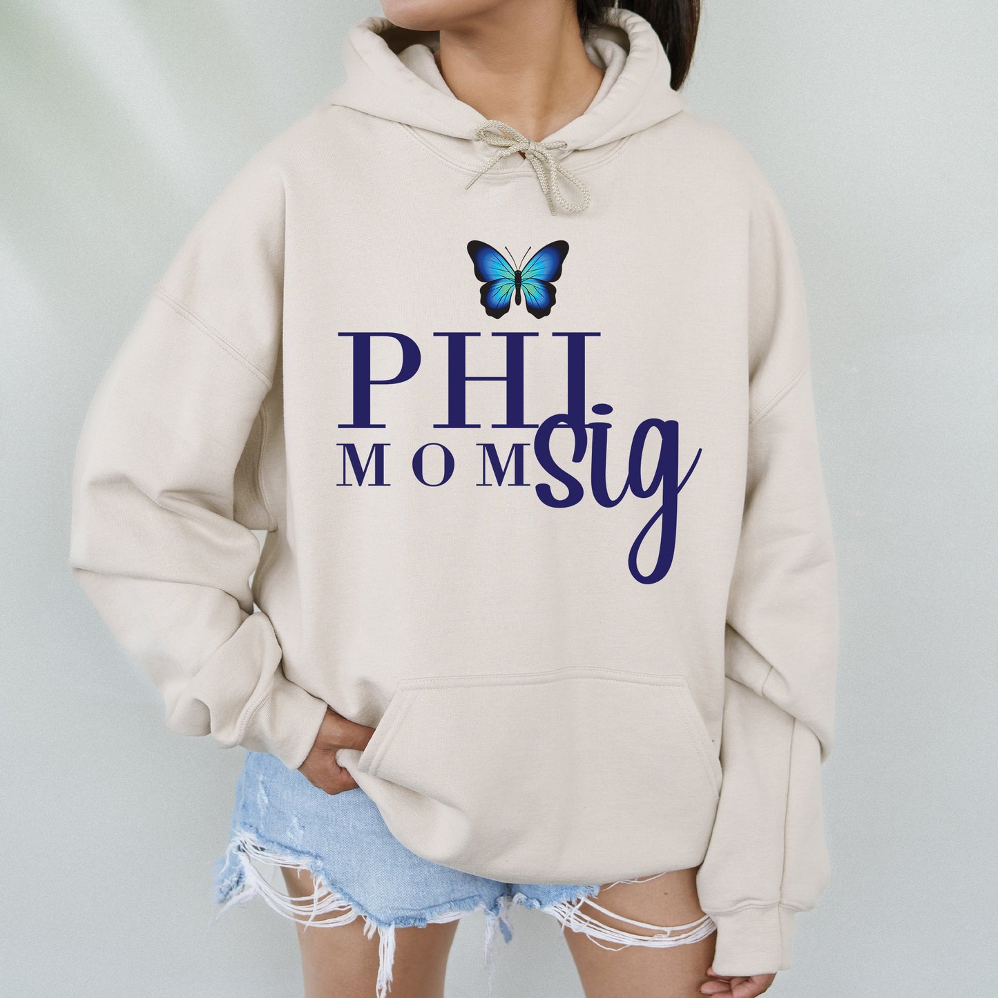 a woman wearing a hoodie with a butterfly on it