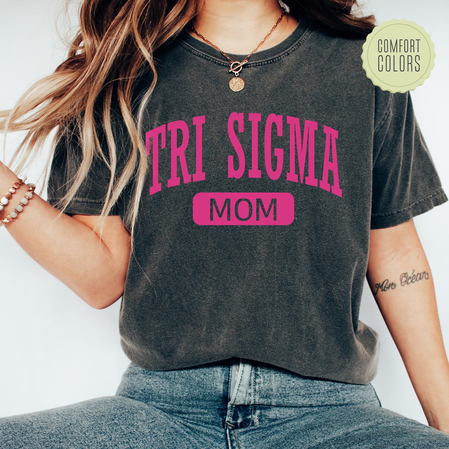 a woman wearing a shirt that says tri stigma mom