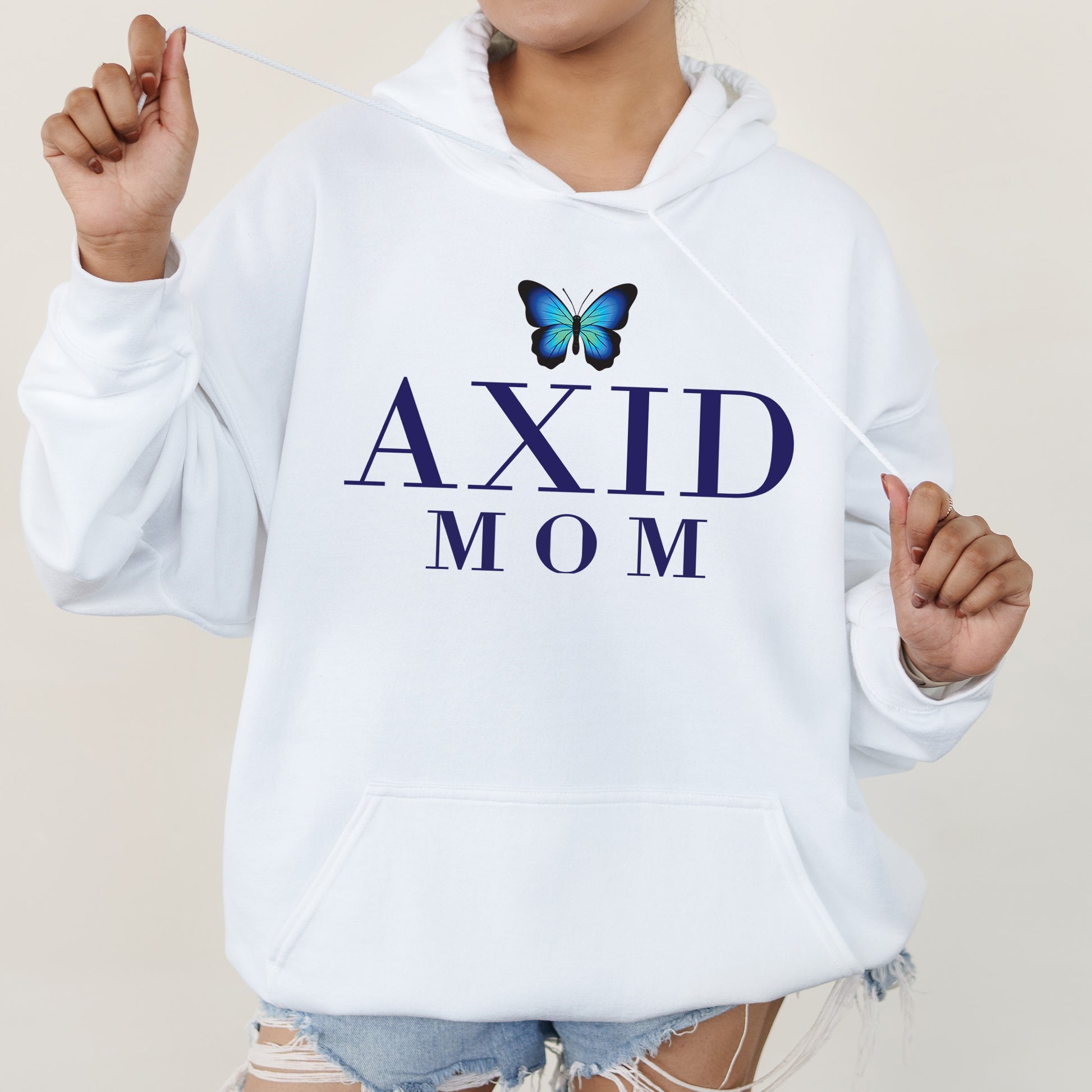 a woman wearing a white hoodie with a butterfly on it