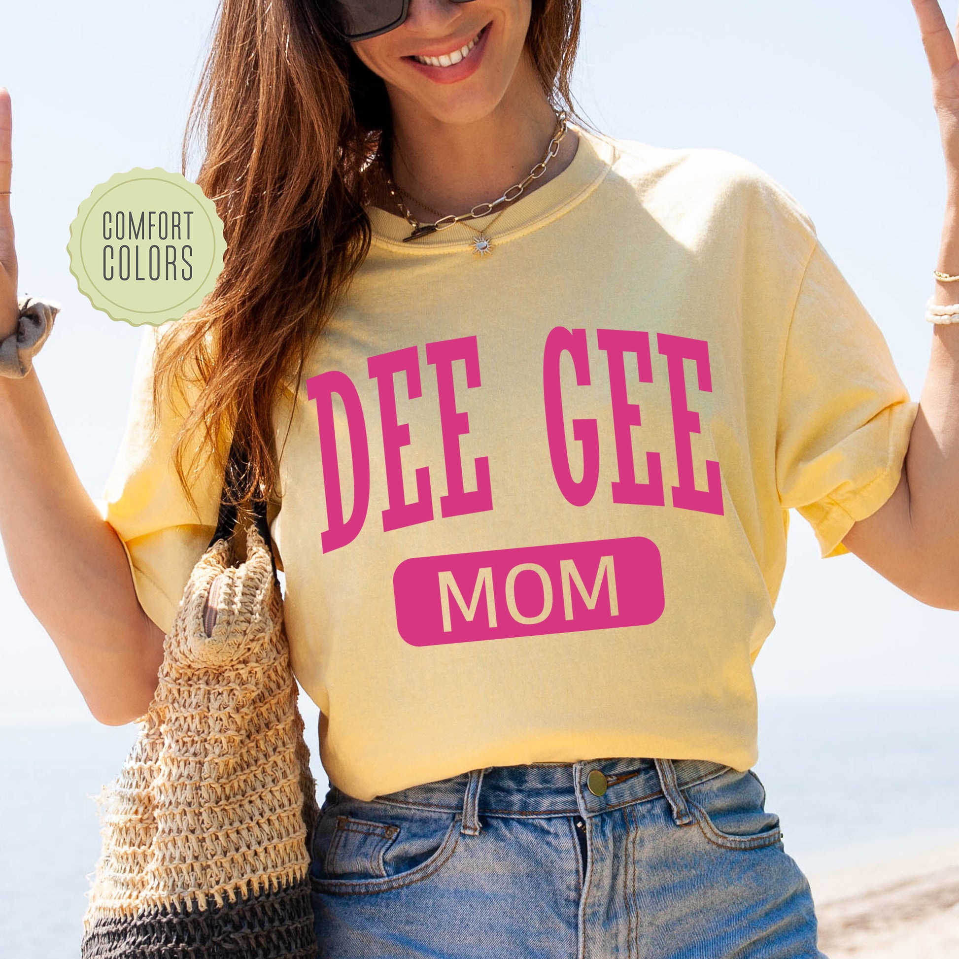 a woman in a yellow shirt is holding a purse