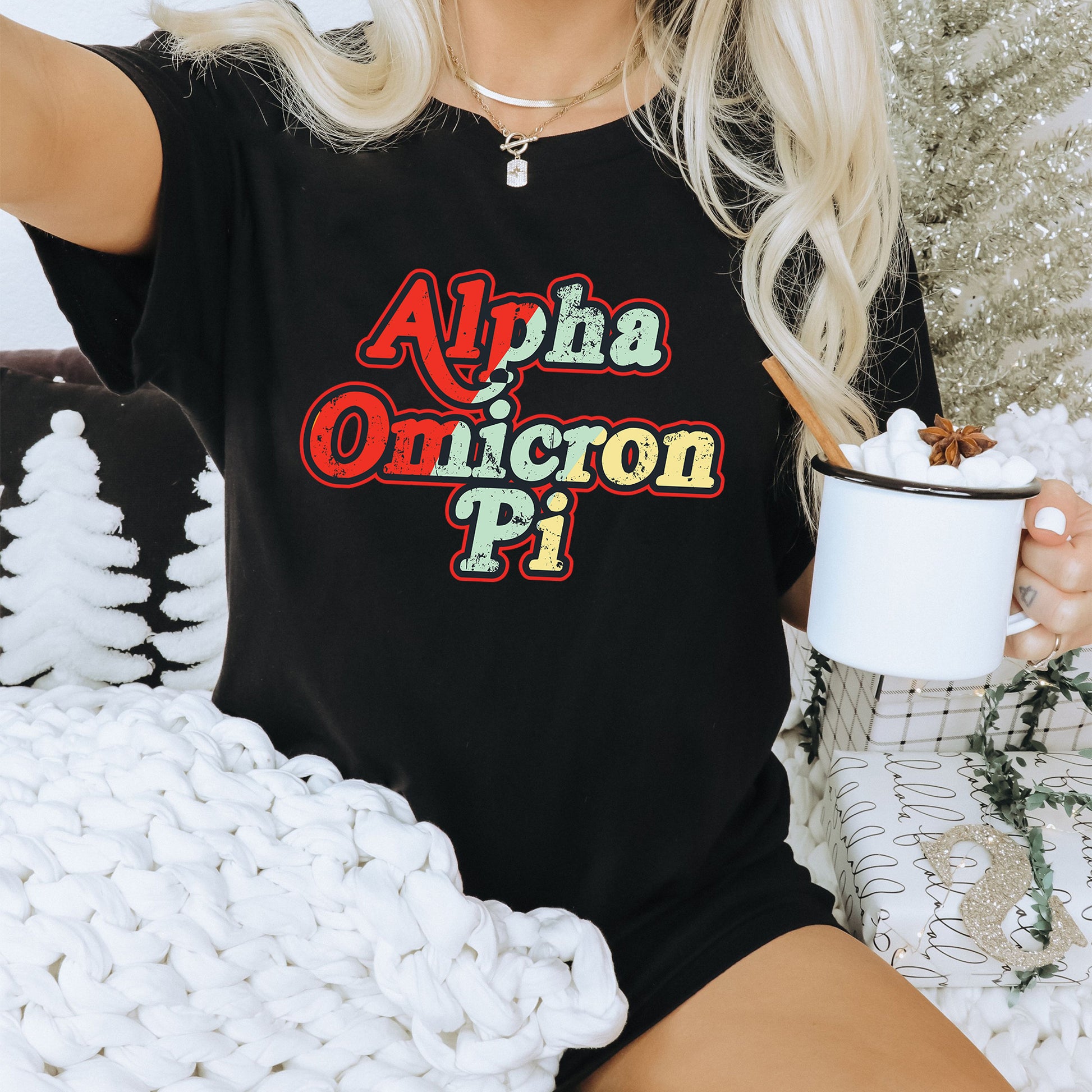 a woman sitting on a couch holding a cup of coffee