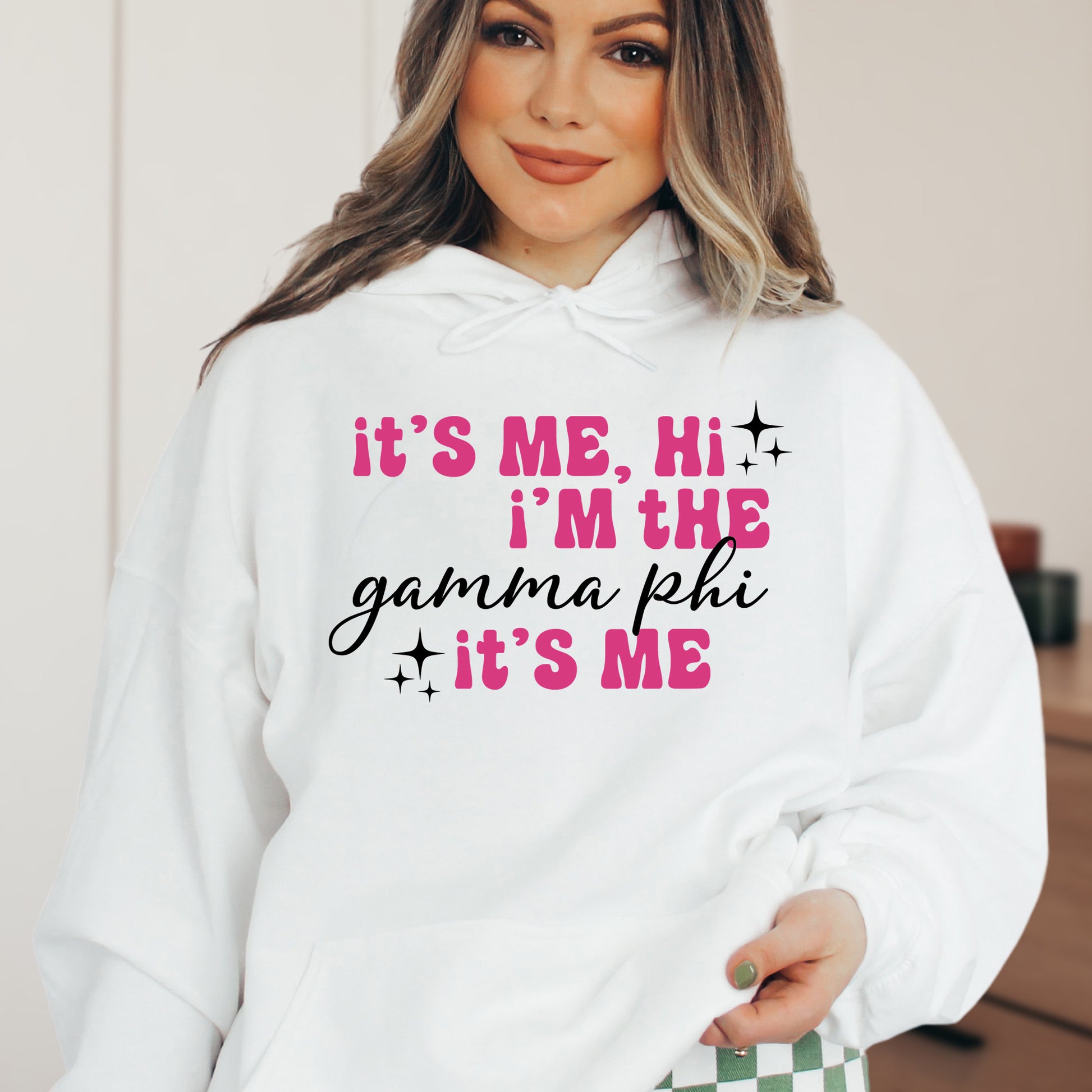 a woman wearing a white hoodie that says it's me, i '