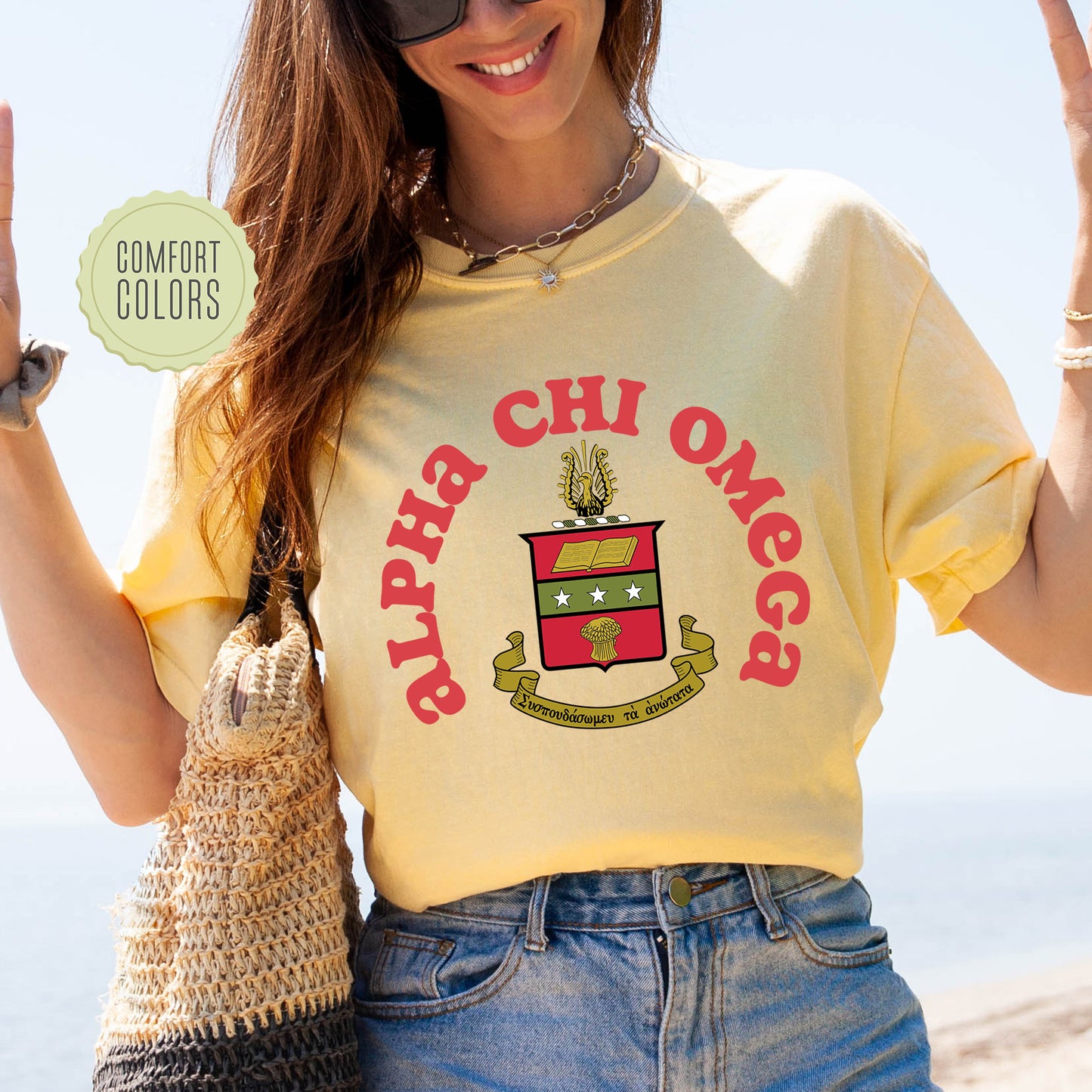 a woman wearing a yellow shirt and holding a purse
