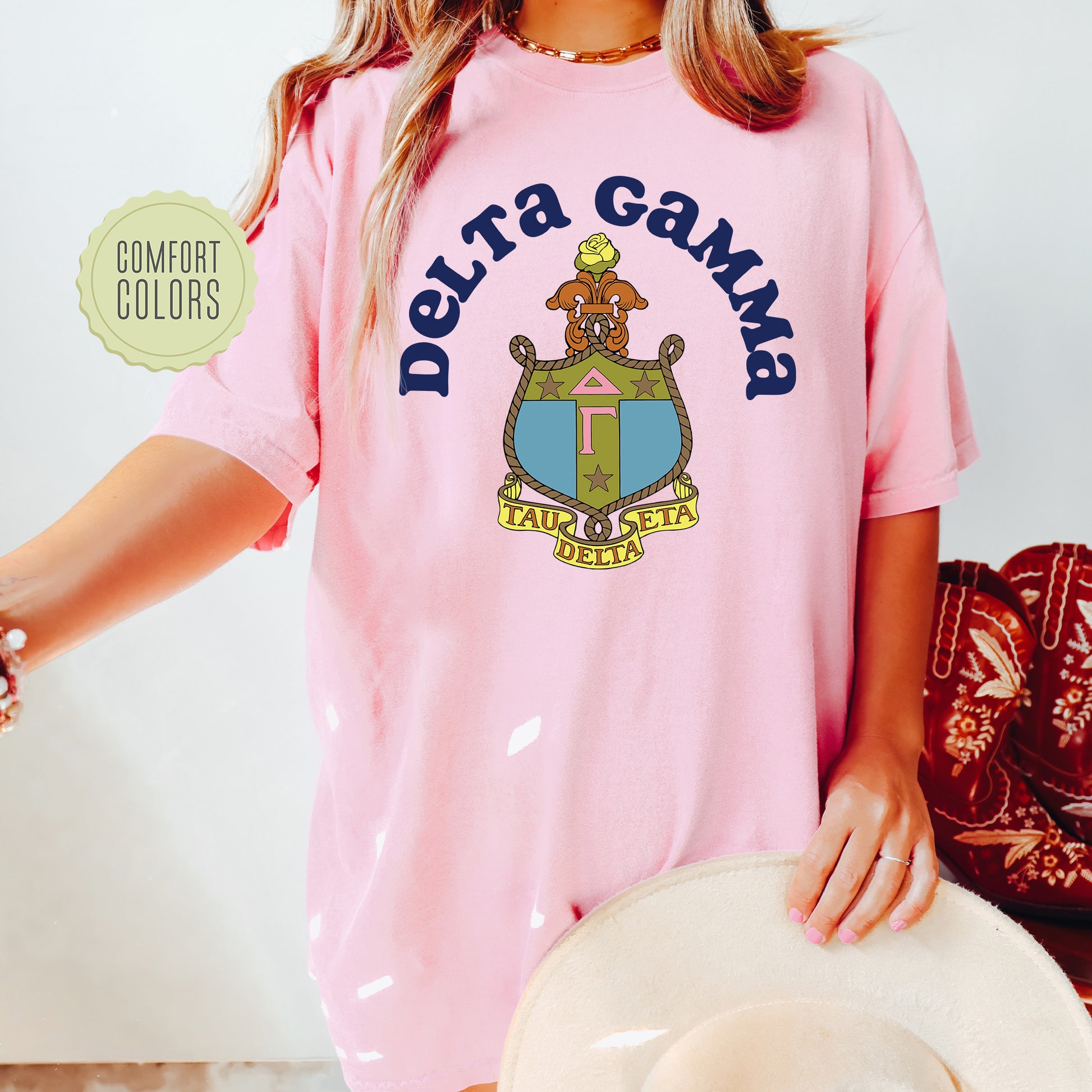a woman wearing a pink shirt and hat