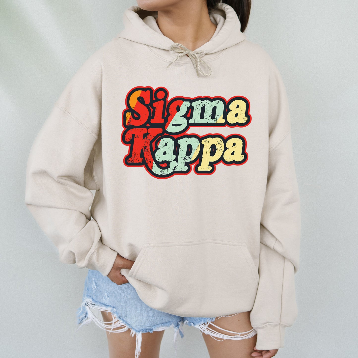 a woman wearing a white sweatshirt with the words simma rappa on it