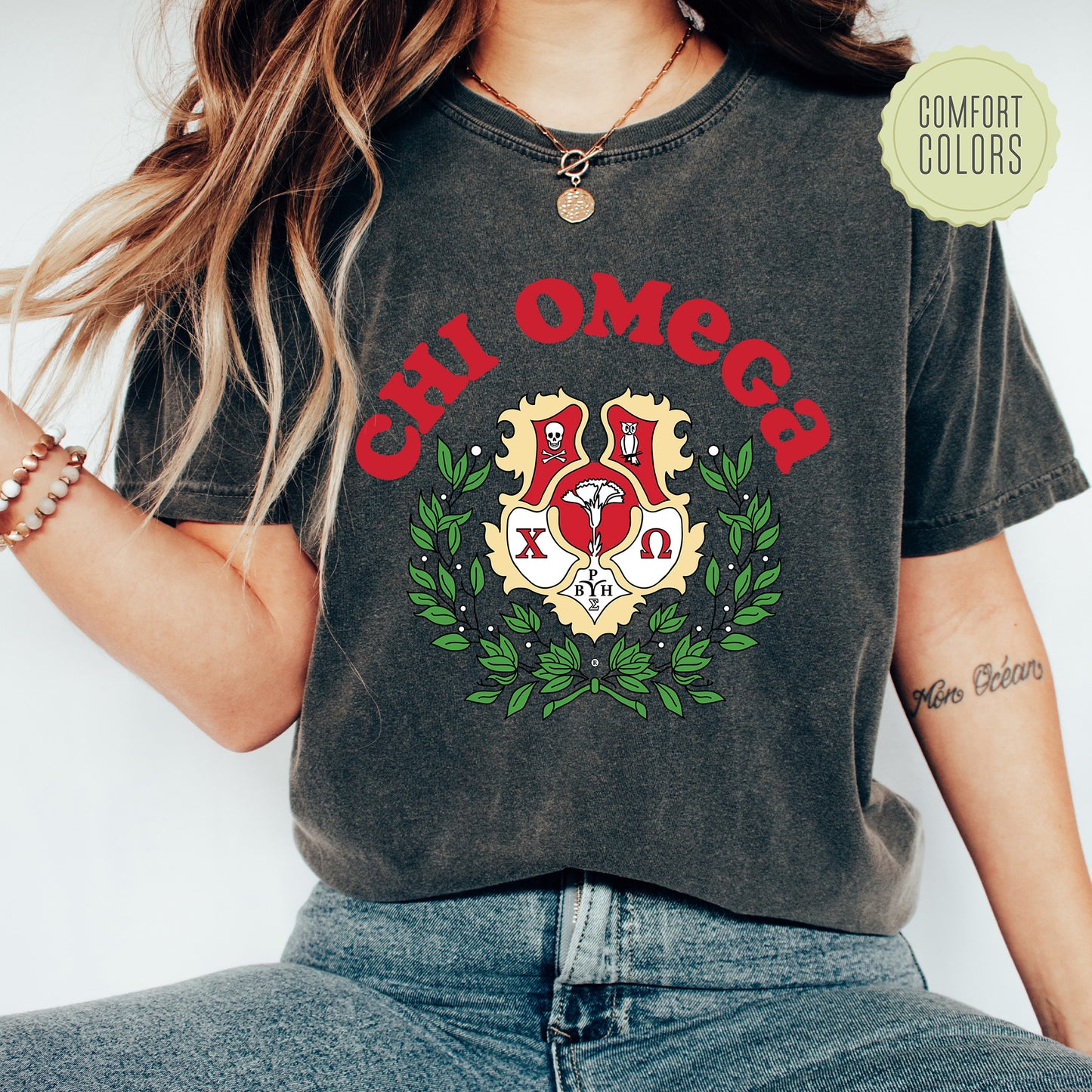a woman wearing a t - shirt that says chi omegg