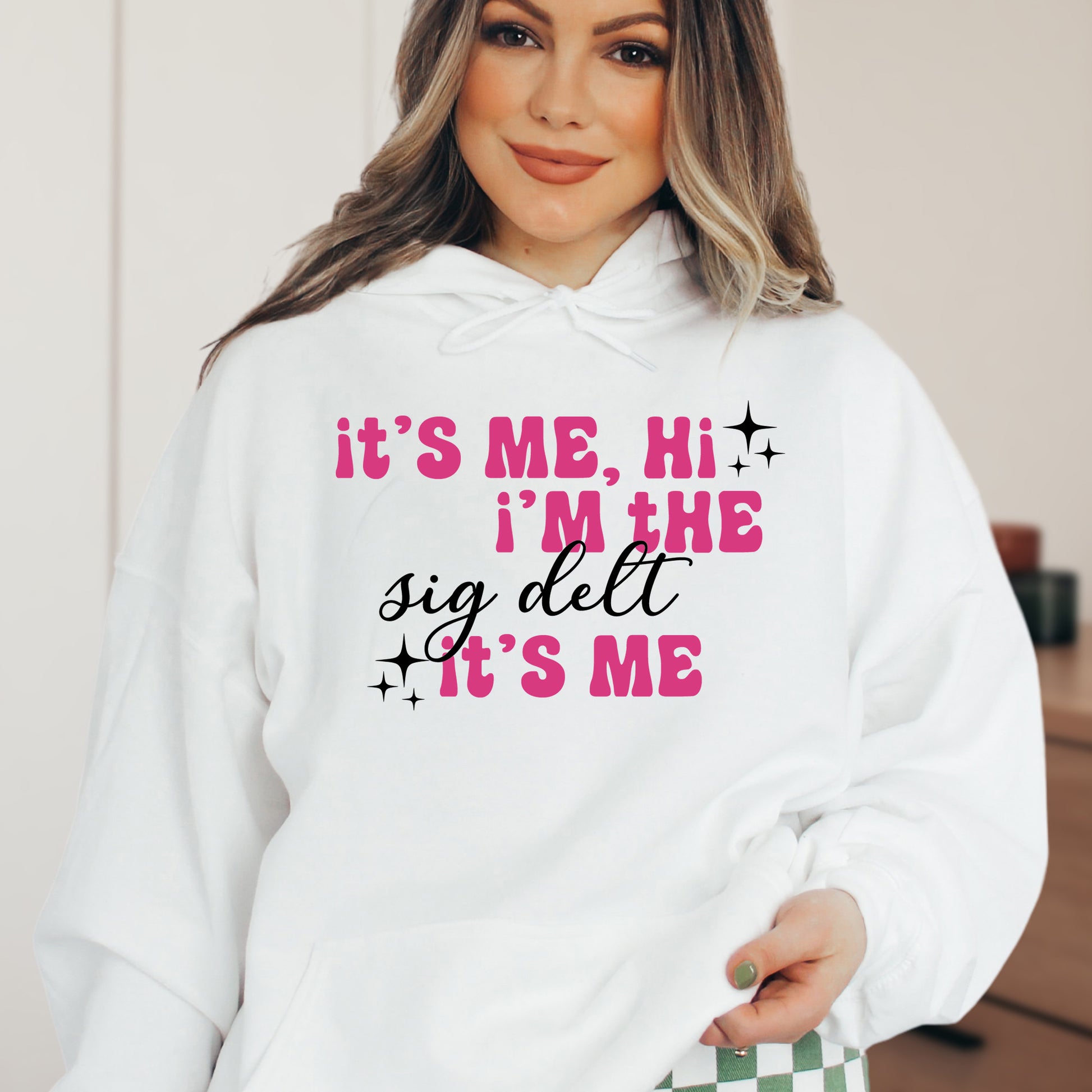 a woman wearing a white hoodie that says it's me, i '