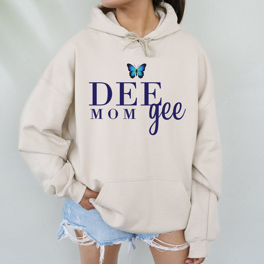 a woman wearing a sweatshirt that says deee mom gee