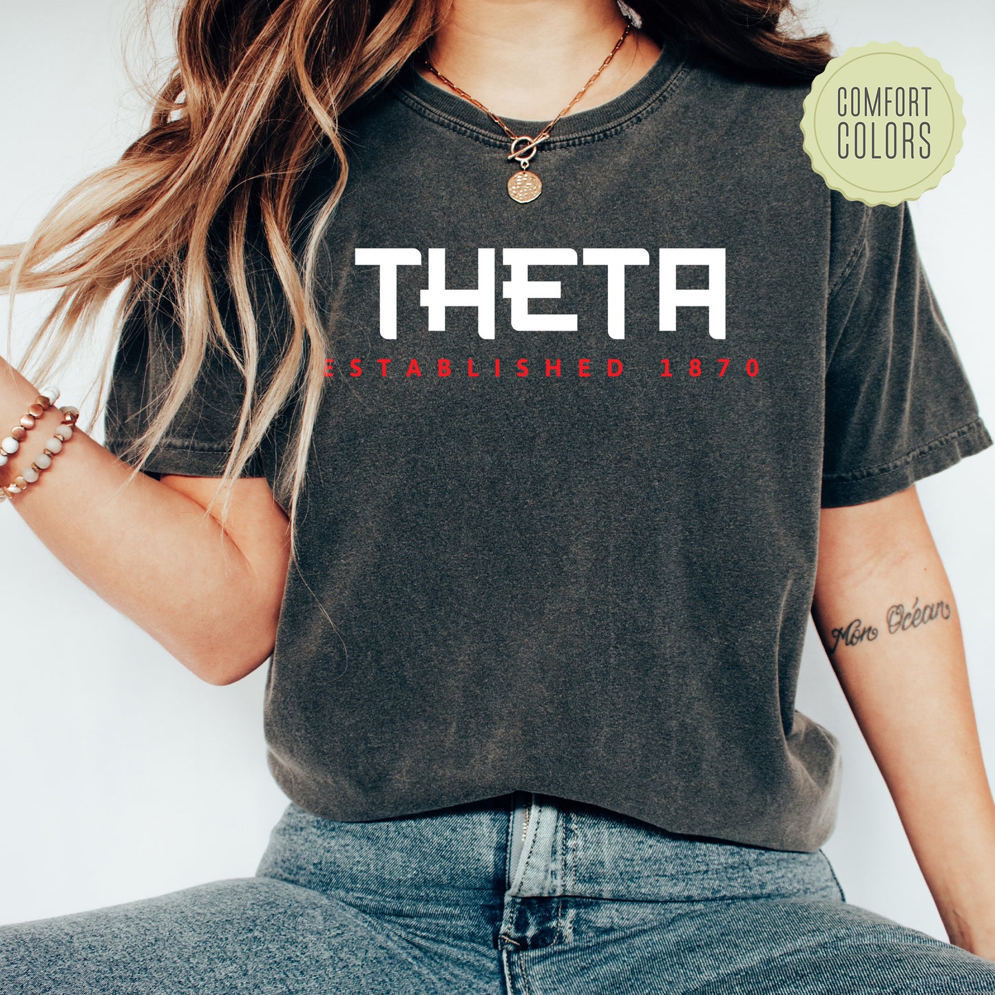 a woman wearing a t - shirt that says thea