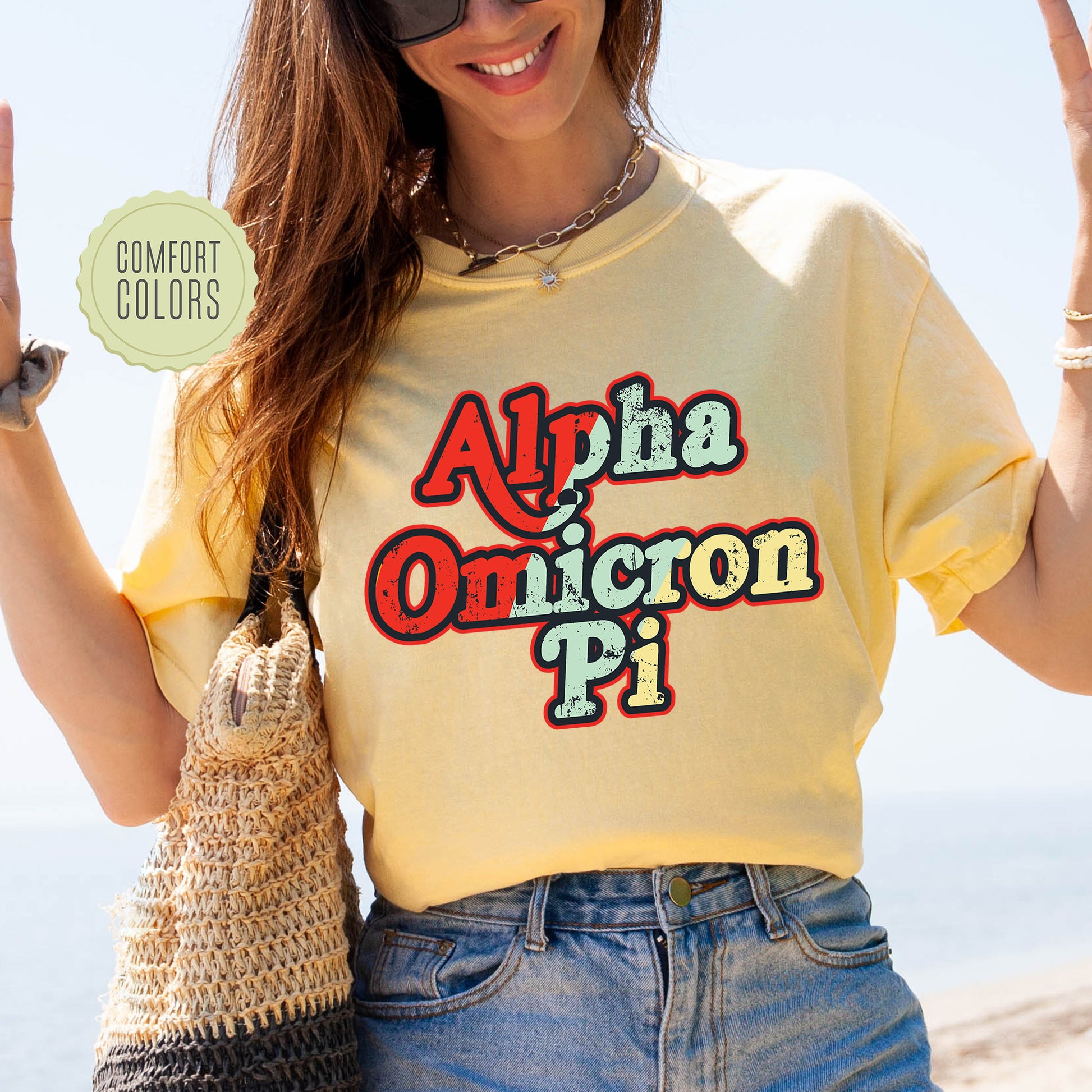 a woman in a yellow shirt is holding up a peace sign