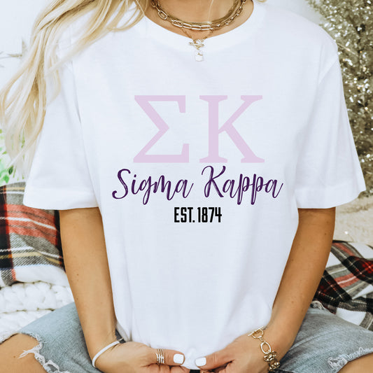 a woman wearing a white tshirt with the letter k on it