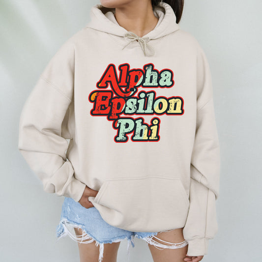 a woman wearing a sweatshirt with the words aloha epsion phi on it