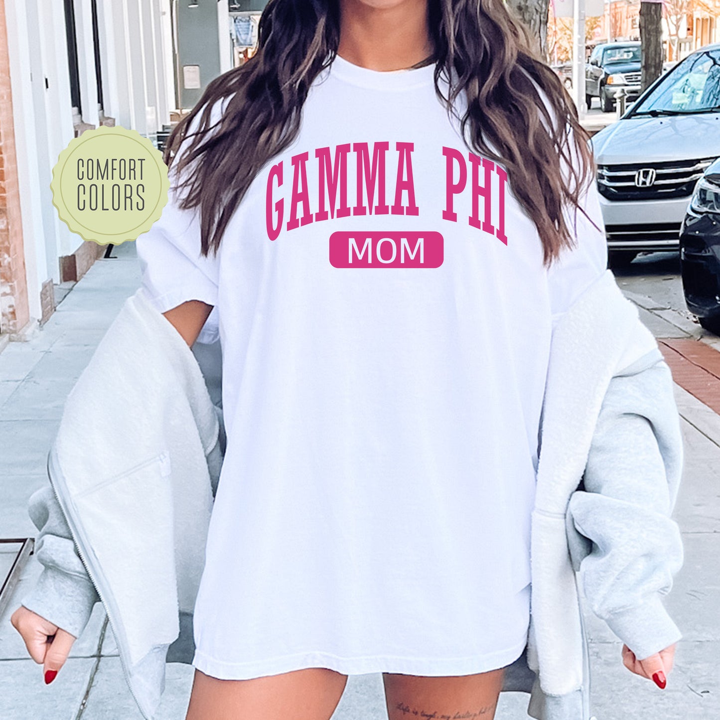 a woman wearing a white shirt and shorts