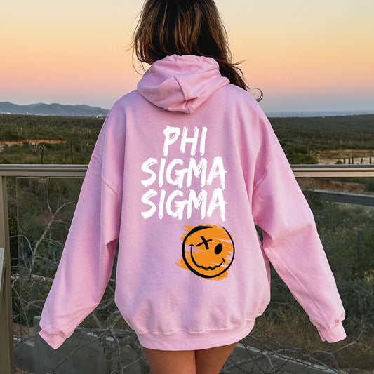 a girl wearing a pink sweatshirt with a pumpkin on it