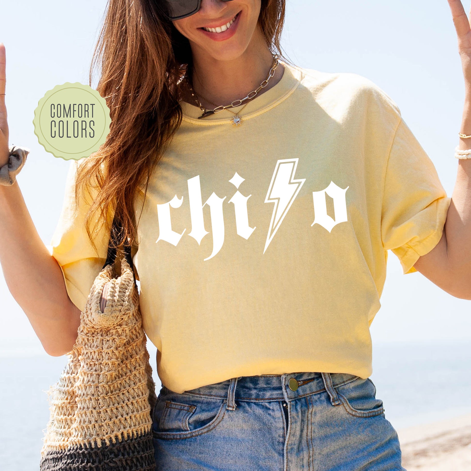 a woman wearing a yellow shirt with a lightning bolt on it
