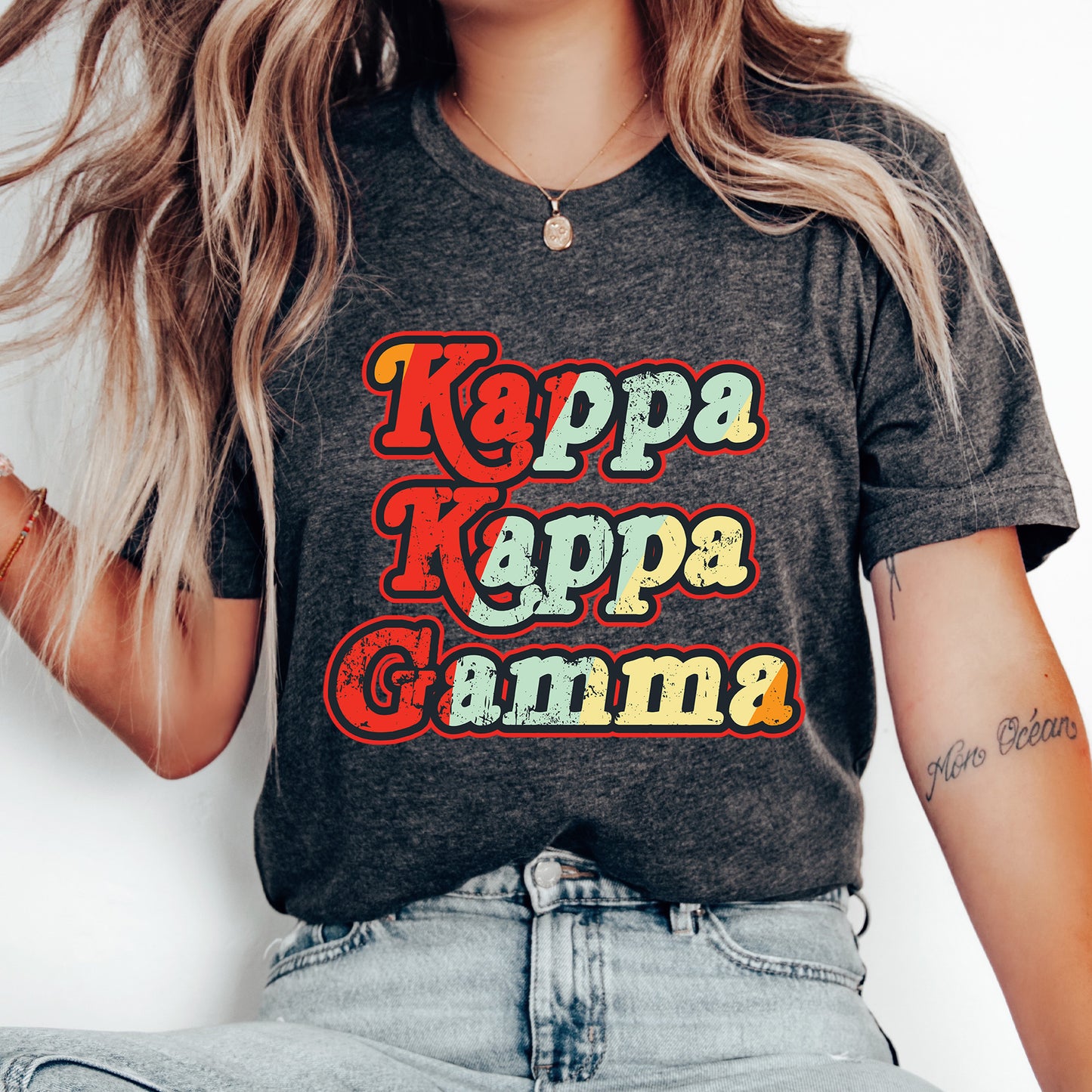 a woman wearing a t - shirt that says kappa kappa ga