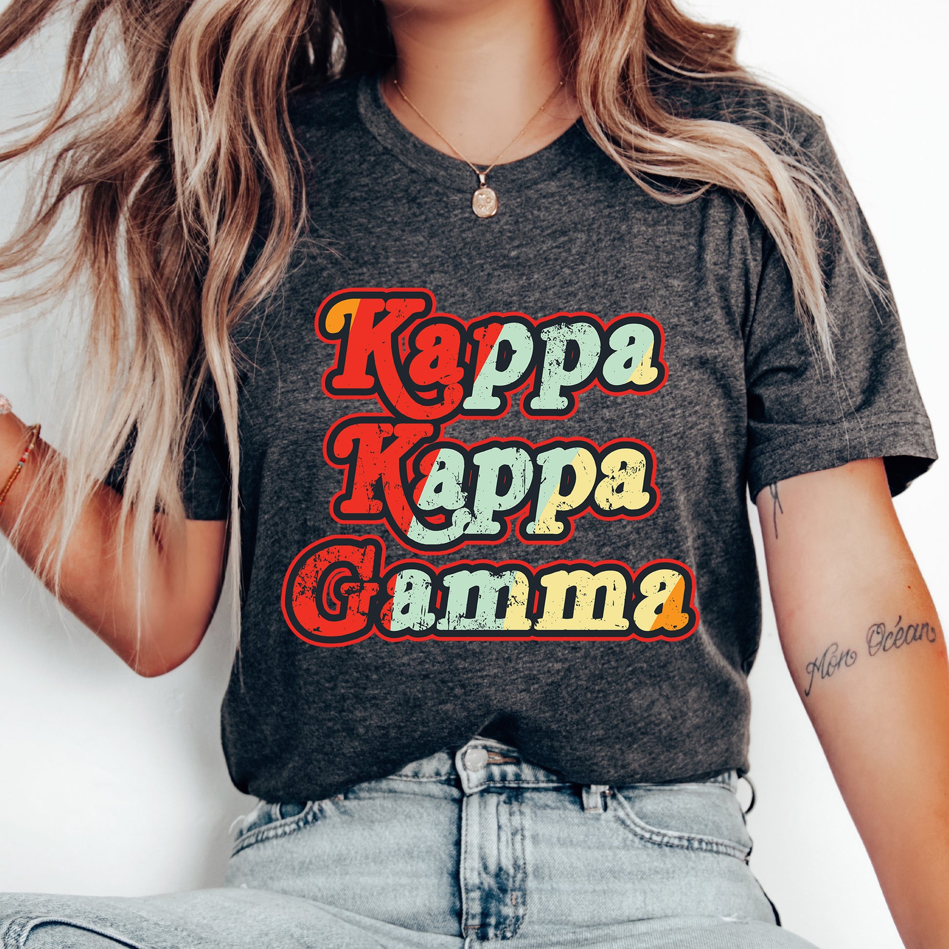 a woman wearing a t - shirt that says kappa kappa ga