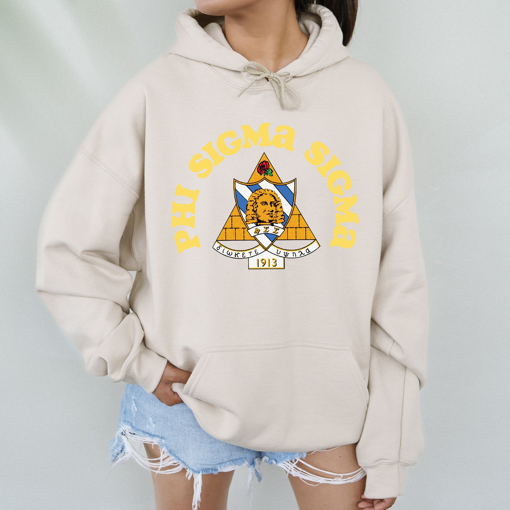 a woman wearing a hoodie with a picture of a cat on it