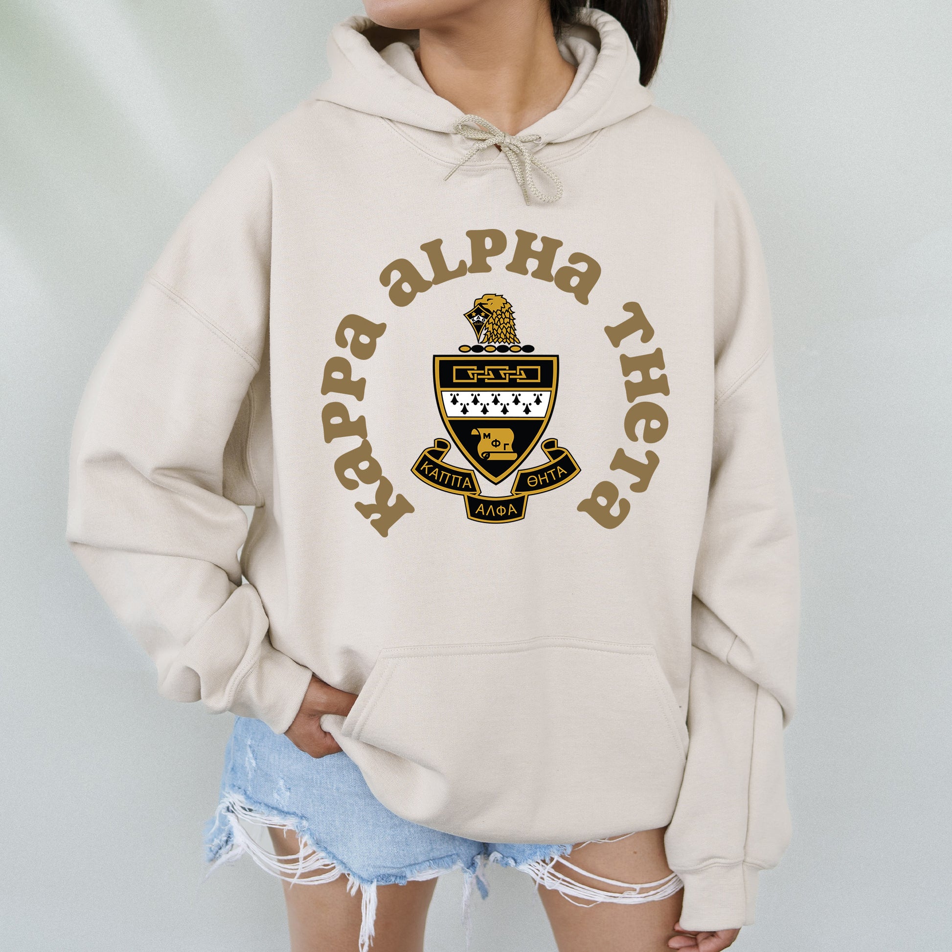 a woman wearing a white hoodie with the words happy birthday on it