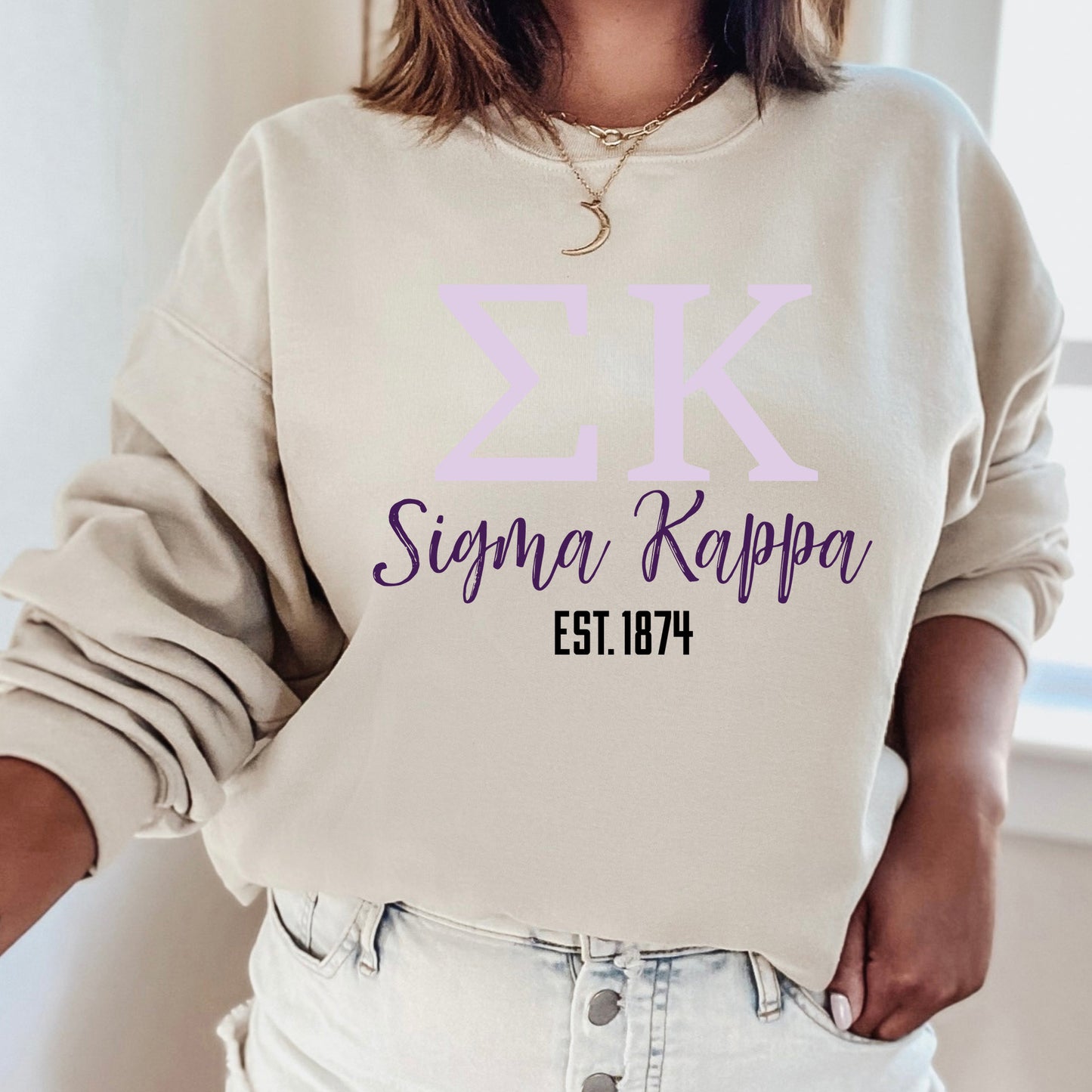 a woman wearing a sweatshirt with the number threek on it