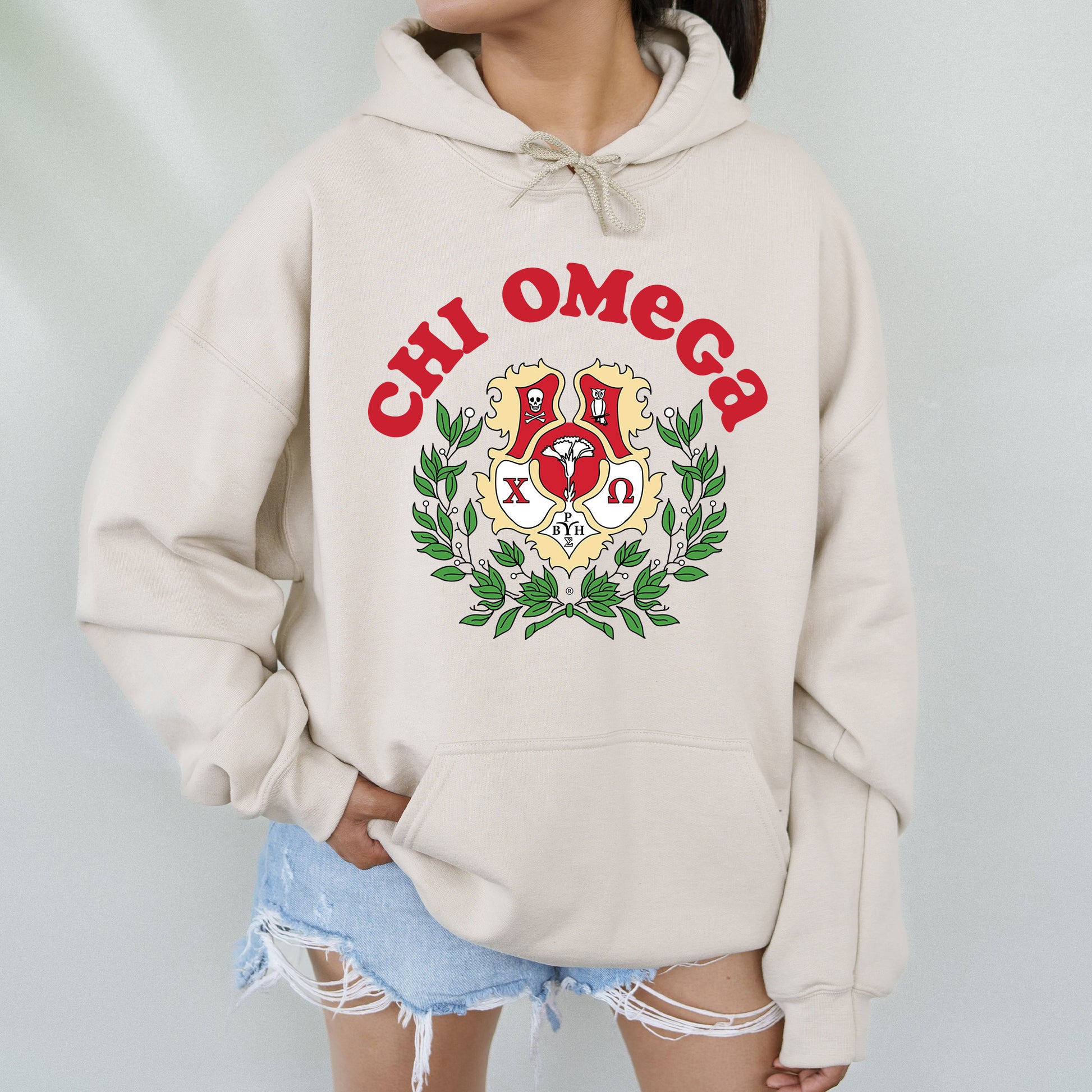 a woman wearing a hoodie with a crest on it