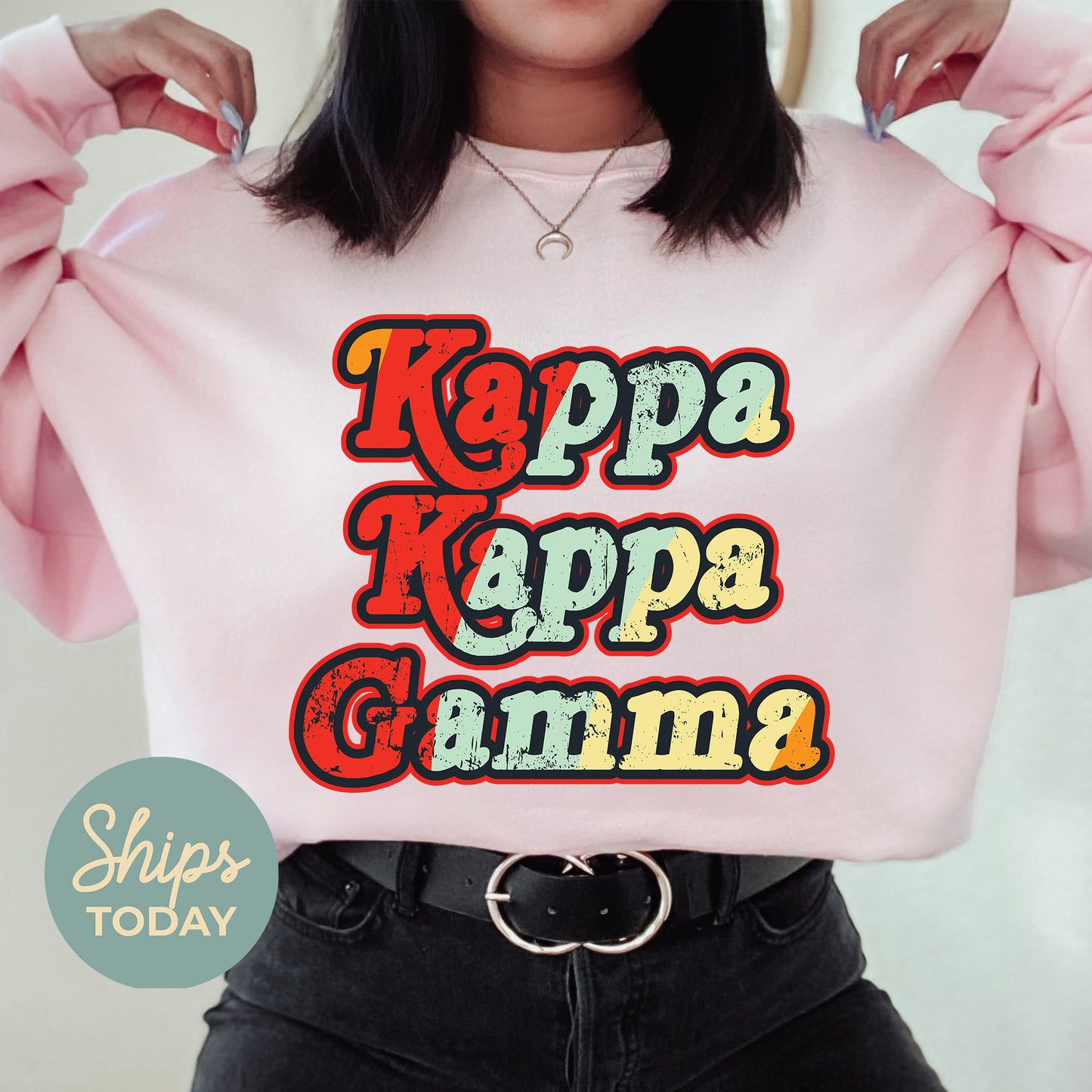 a woman wearing a pink sweatshirt with the words kapp kapp gumma on