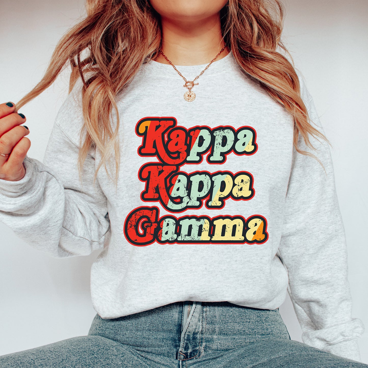 a woman wearing a sweatshirt that says kapp kapp gumma