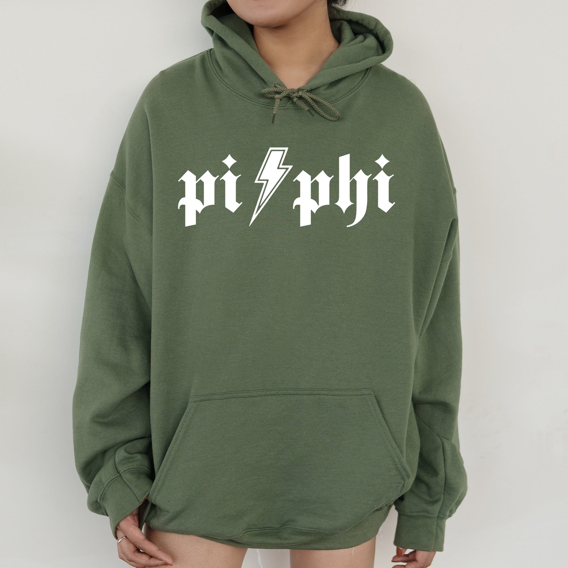 a person wearing a green hoodie with a lightning bolt on it