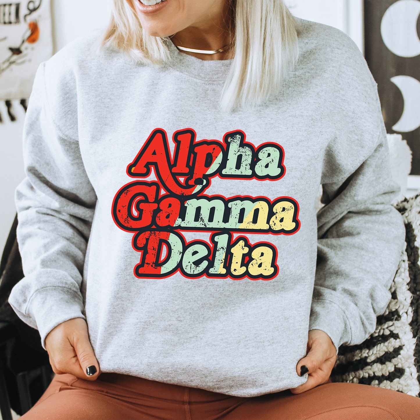 a woman wearing a sweatshirt that says aloha gamma delta