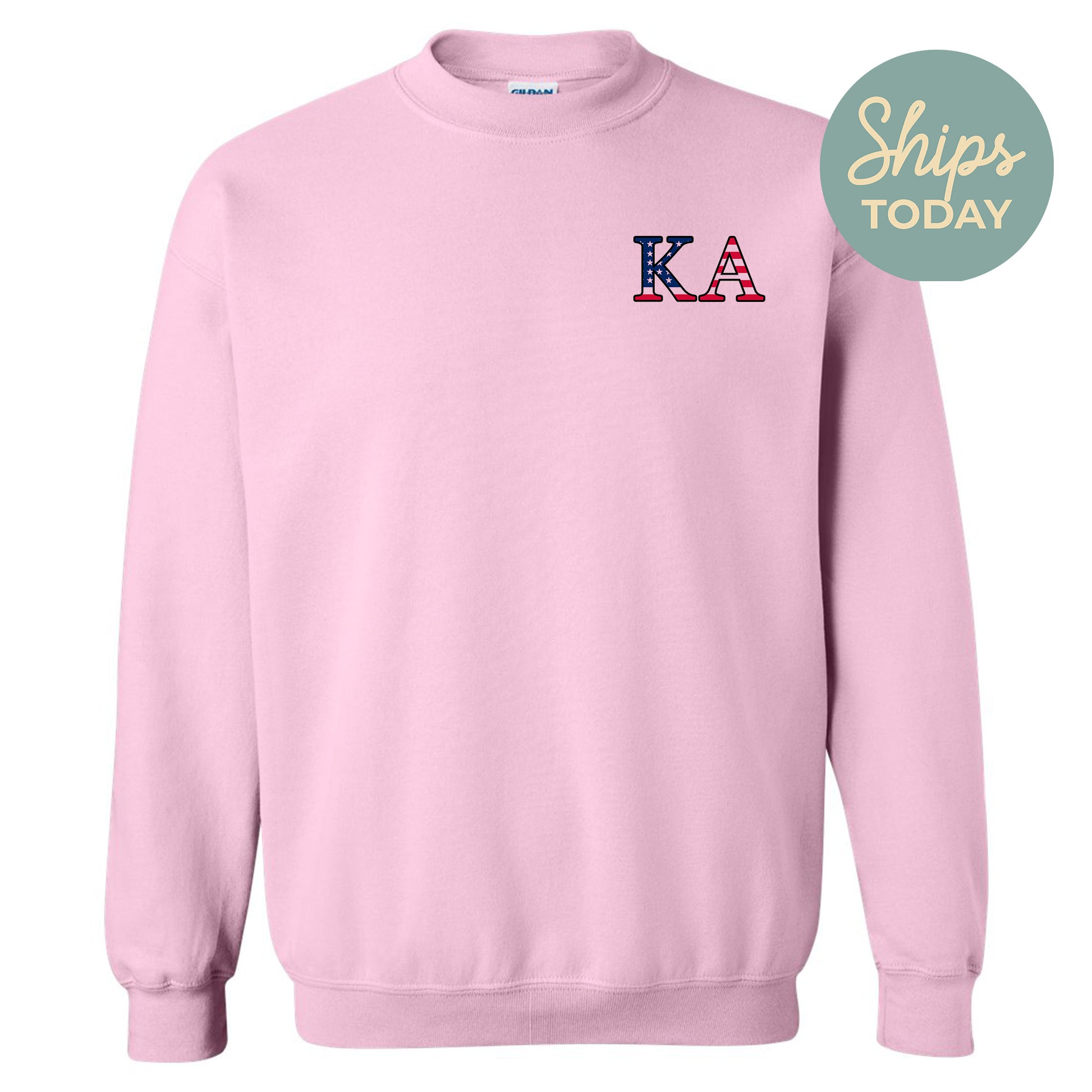 a pink sweatshirt with the letter k in red, white, and blue
