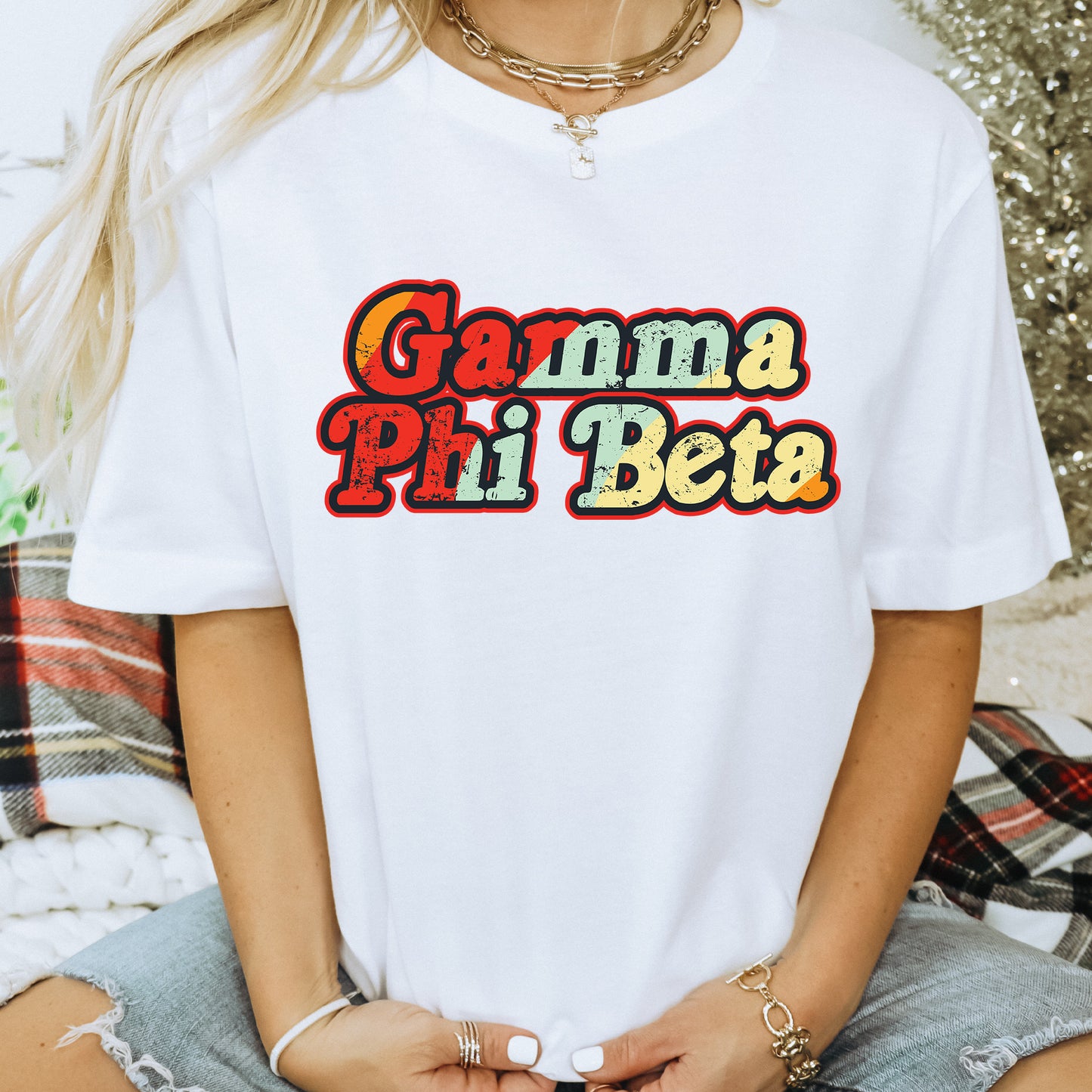 a woman wearing a white t - shirt with the words gama pili bet