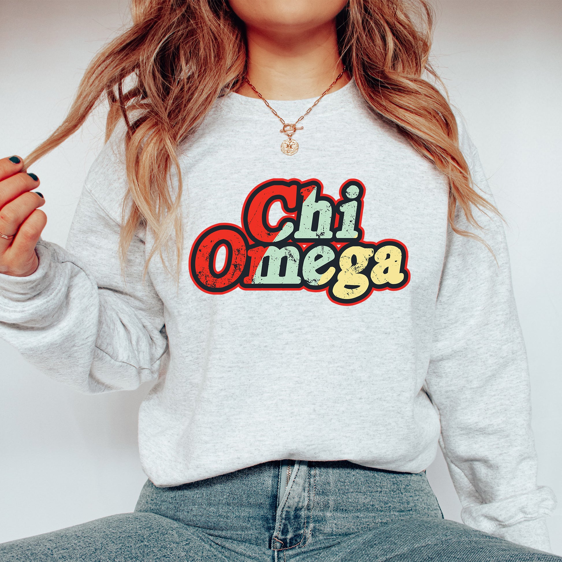 a woman wearing a sweatshirt with the word chi onega on it
