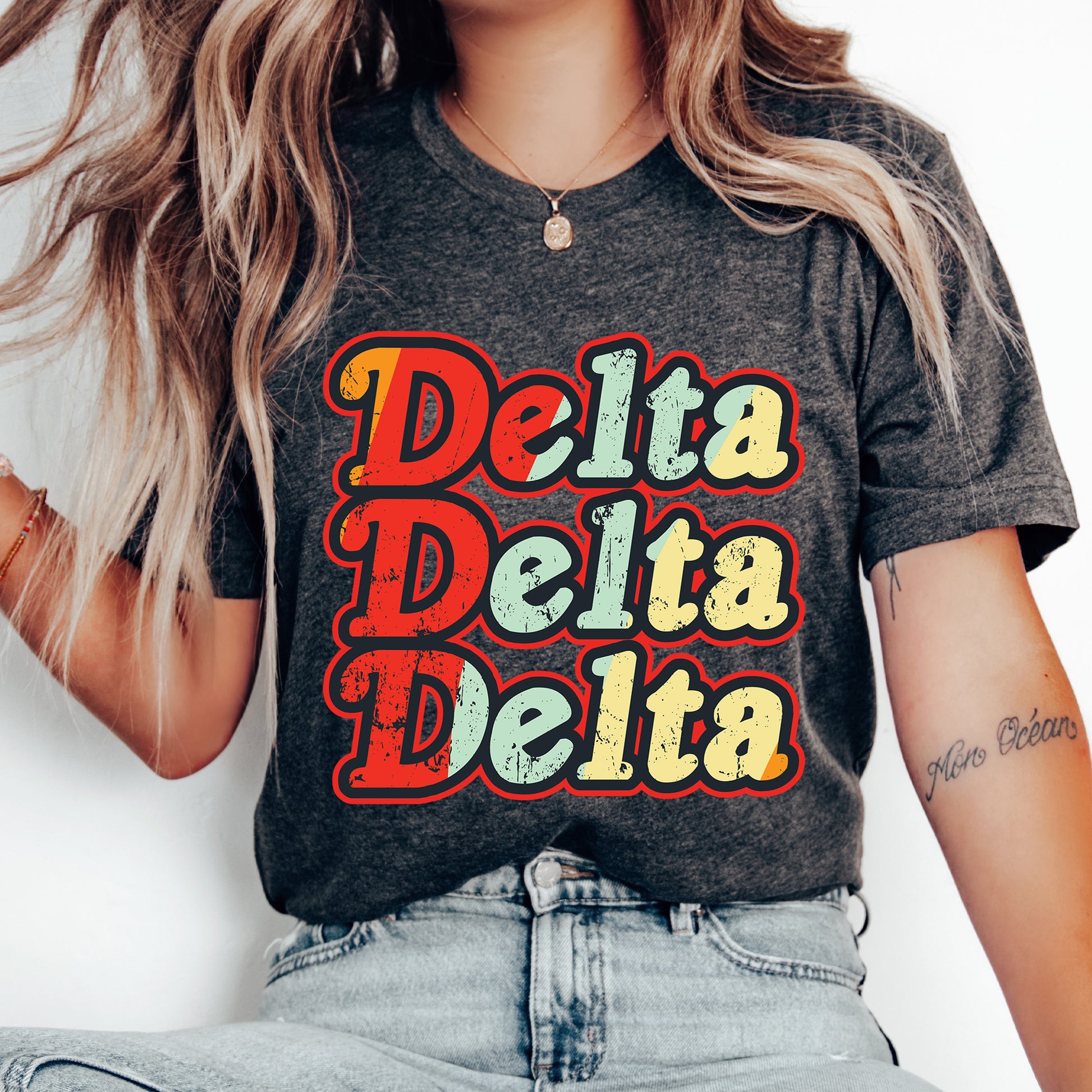 a woman wearing a shirt that says delta delta