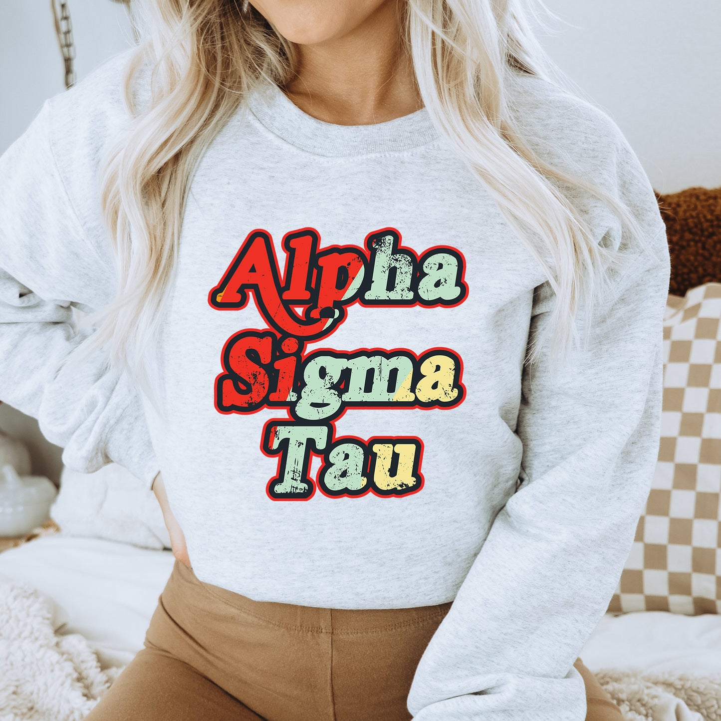 a woman wearing a sweatshirt that says aloha stigma taq