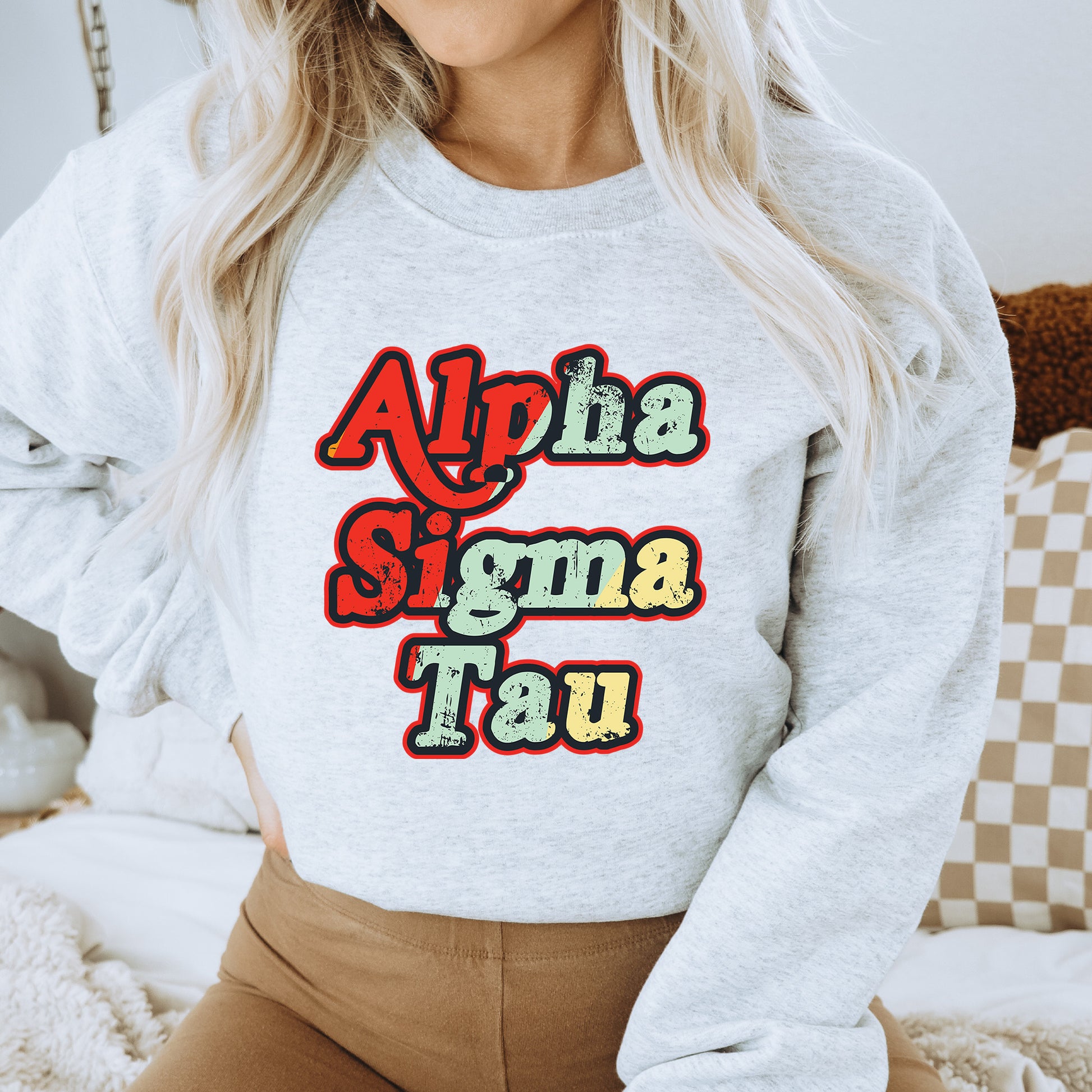 a woman wearing a sweatshirt that says aloha stigma taq