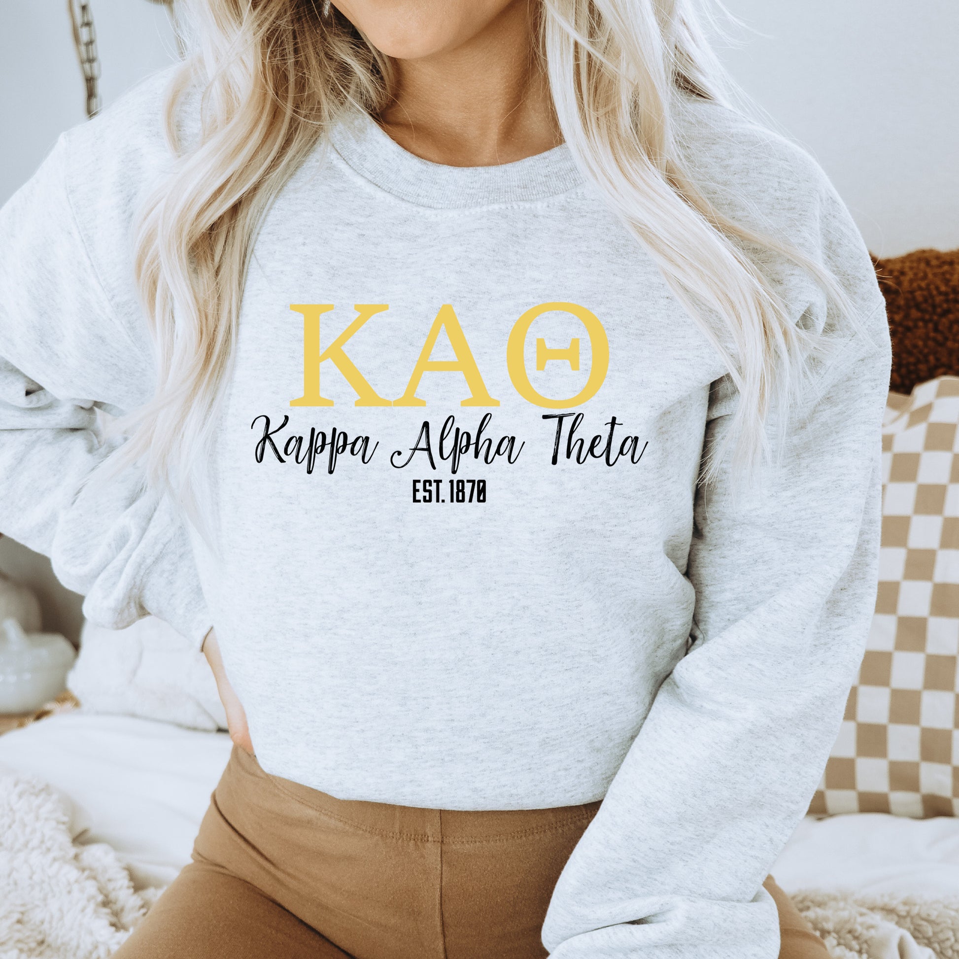 a woman wearing a sweatshirt that says kao