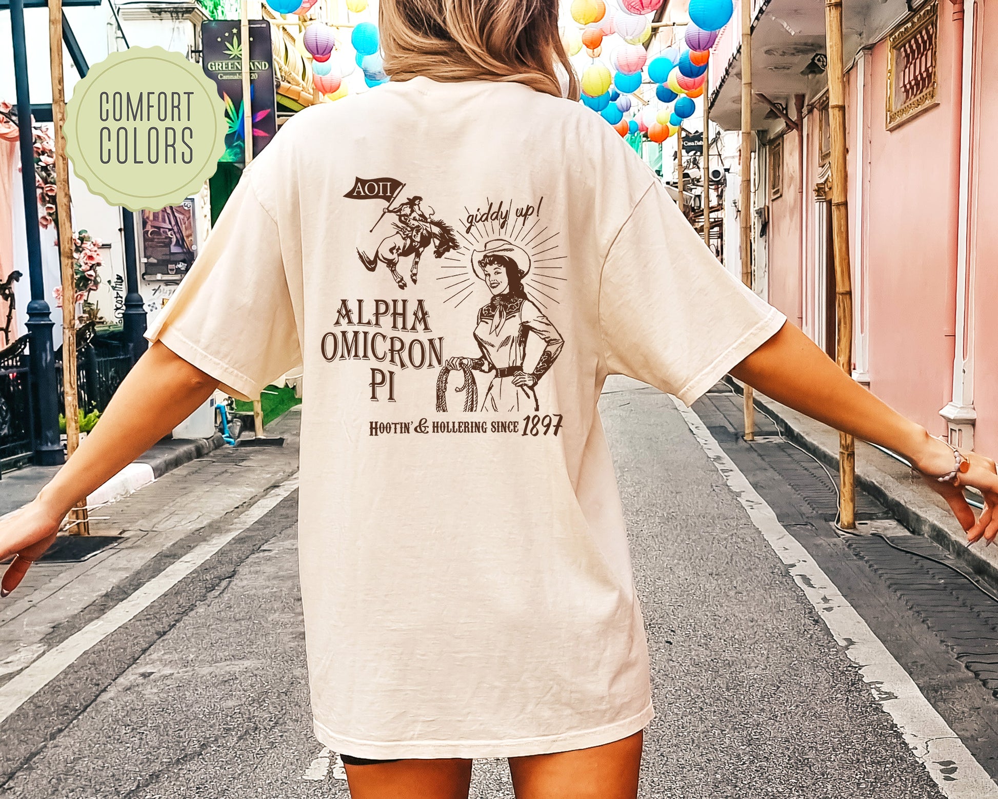 a woman walking down a street holding onto a skateboard