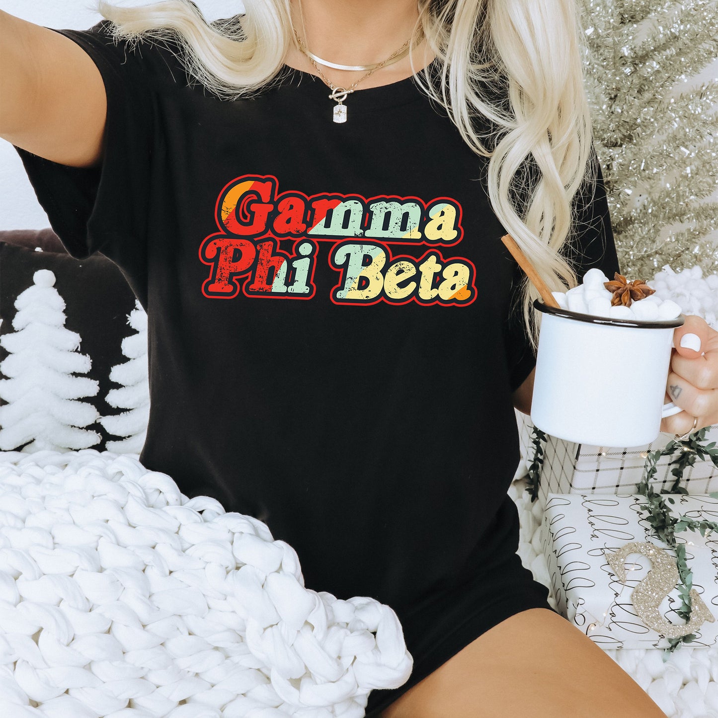 a woman sitting on a couch holding a cup of coffee