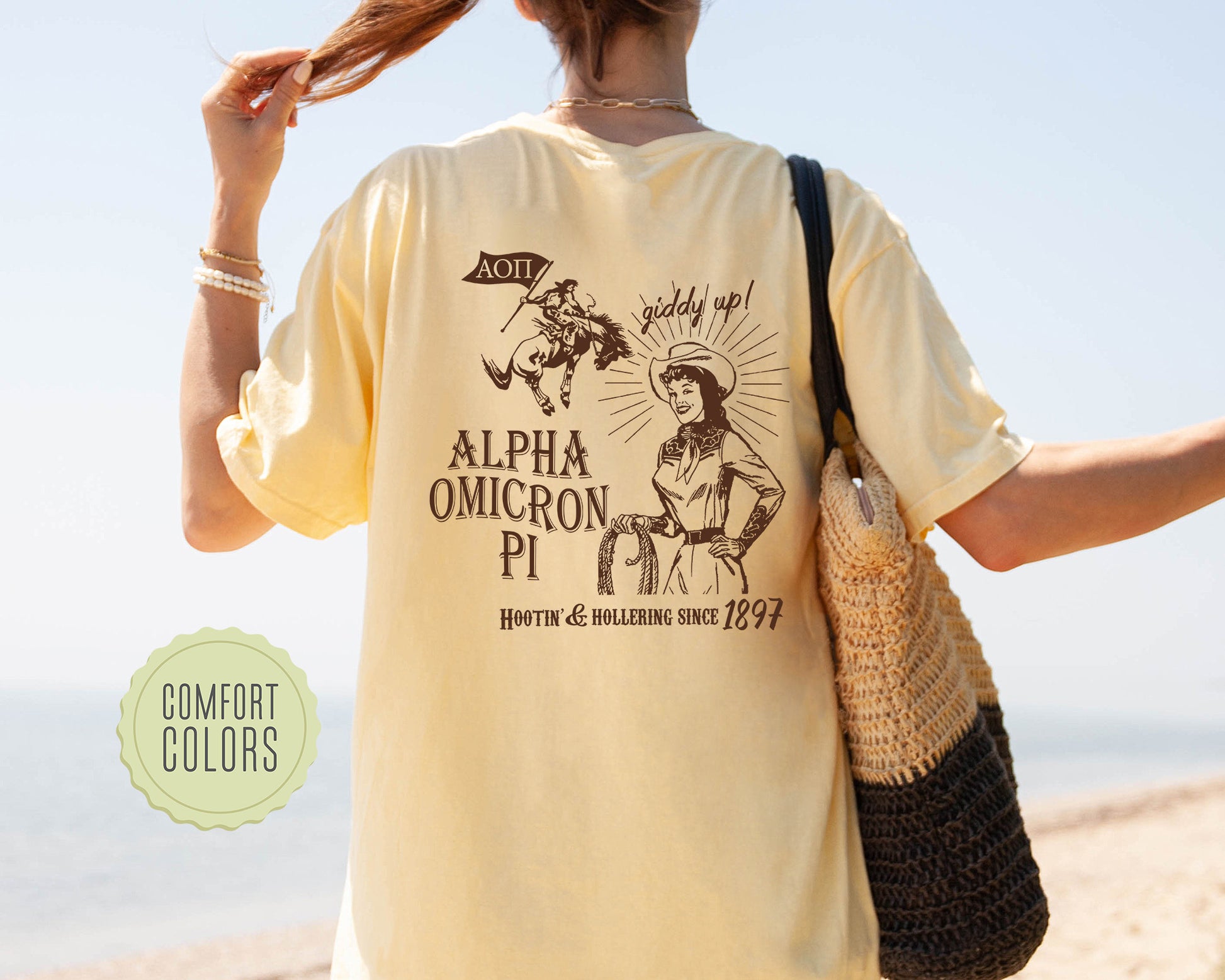 a woman walking on a beach carrying a purse