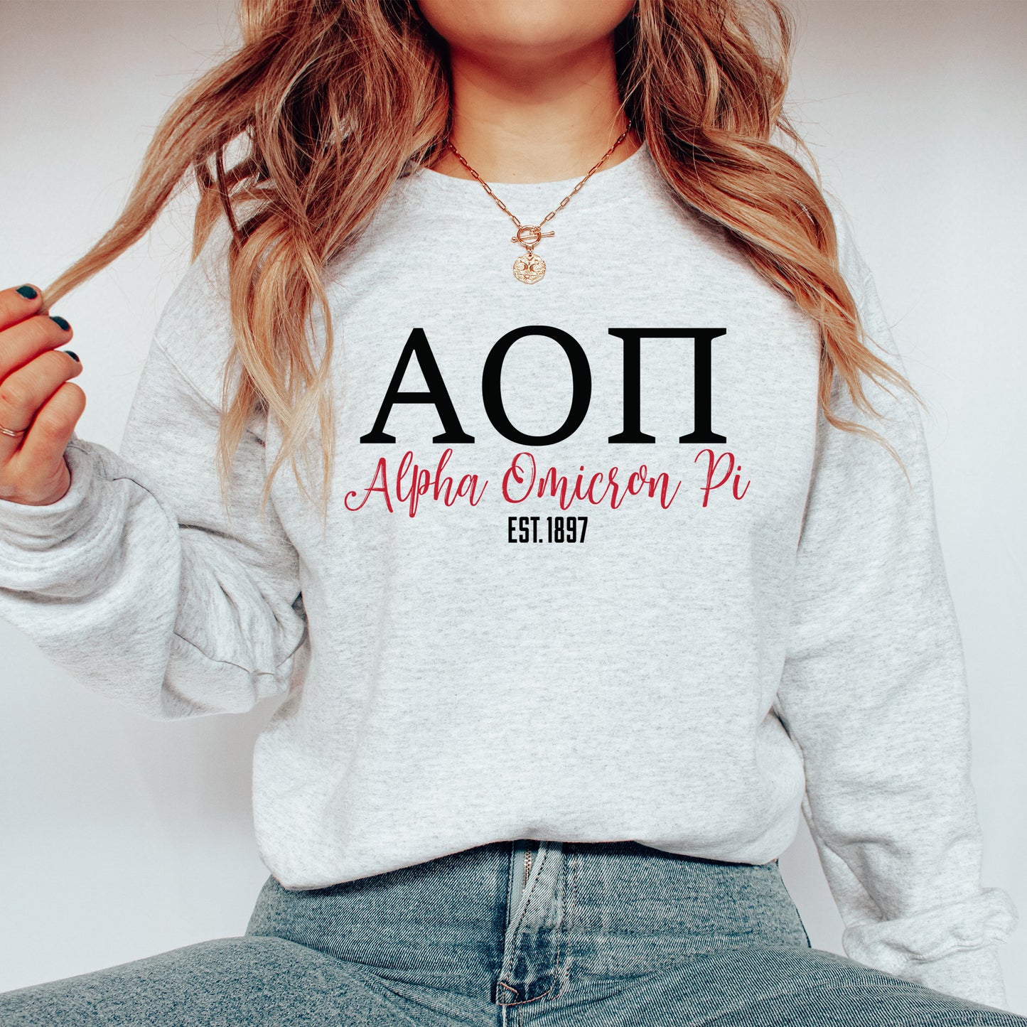 a woman wearing a sweatshirt with the word aoi on it