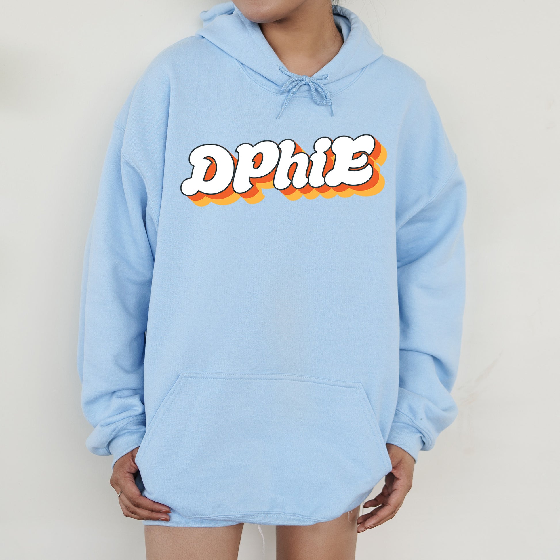 a person wearing a blue hoodie with the word dppie on it