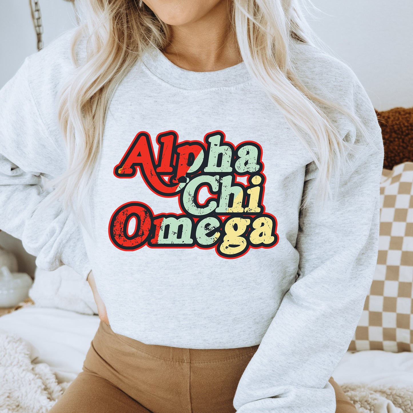 a woman wearing a sweatshirt that says aloh chi onega