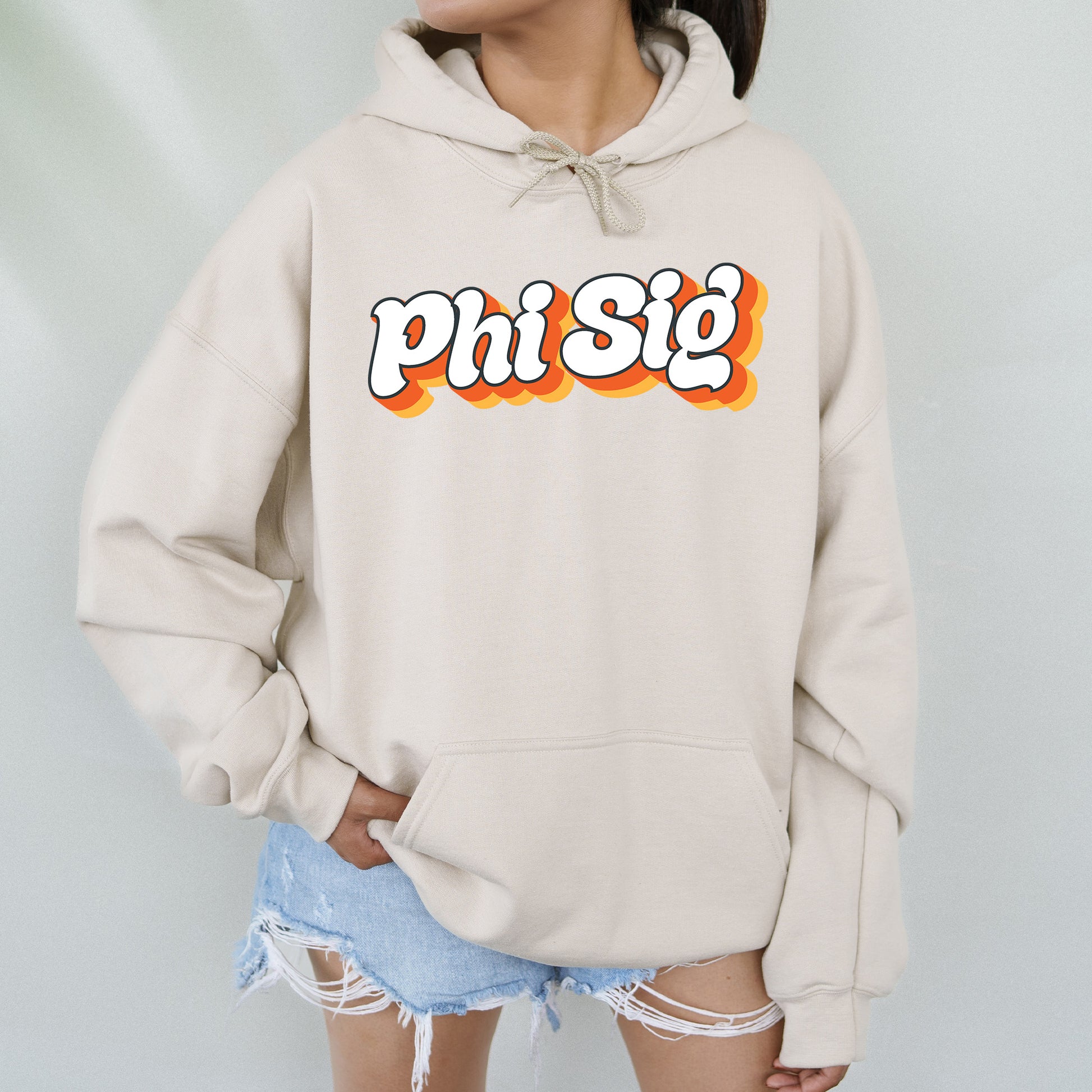 a woman wearing a sweatshirt that says phi sig