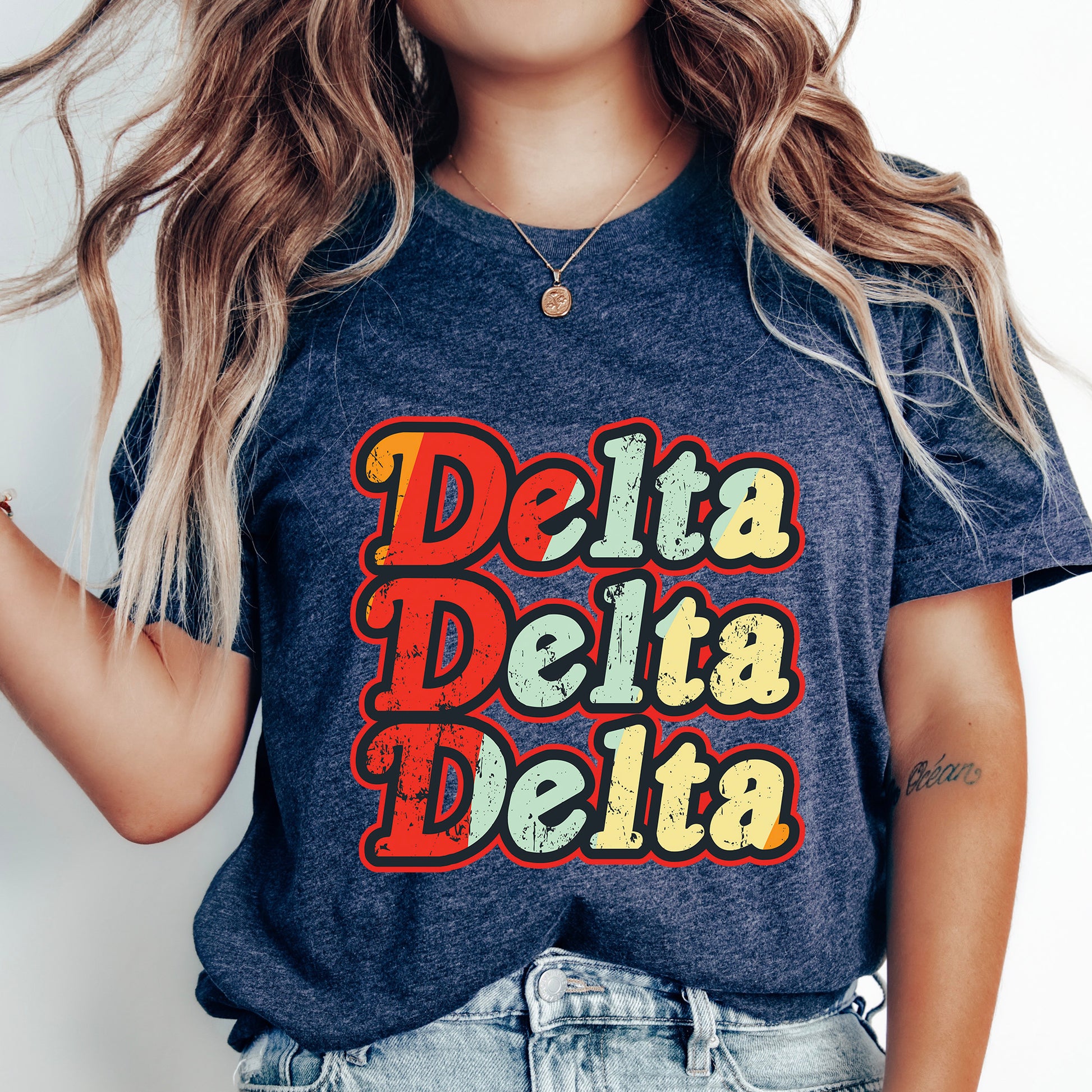 a woman wearing a t - shirt that says delta delta