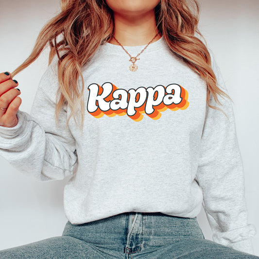 a woman wearing a sweatshirt with the word kappa on it