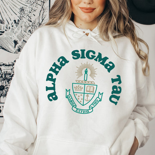 a woman wearing a white hoodie with a green logo on it