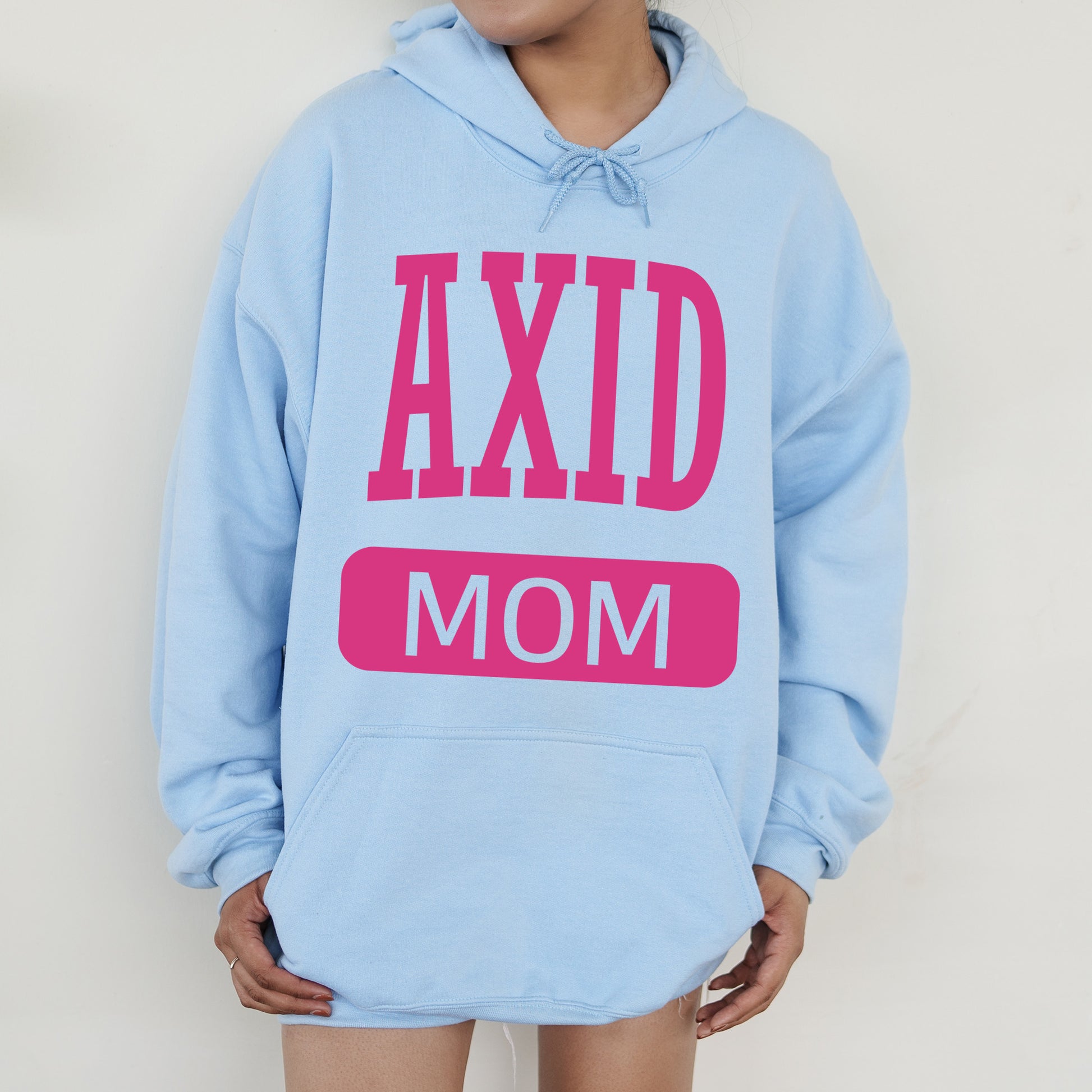 a woman wearing a blue hoodie that says axd mom