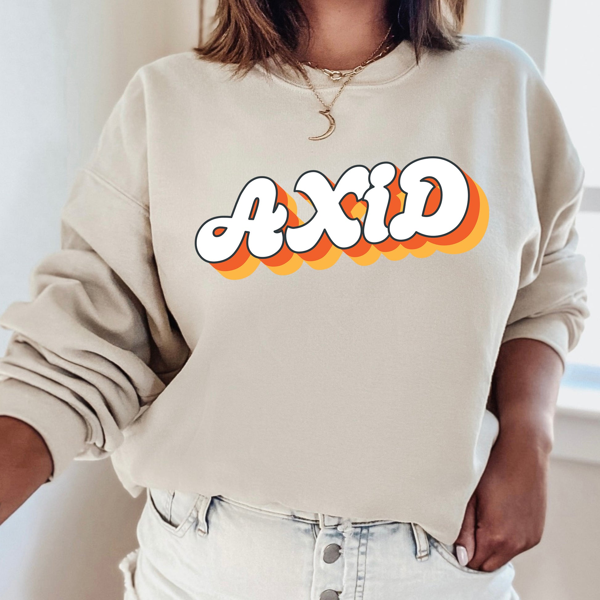a woman wearing a sweatshirt with the word dxd printed on it