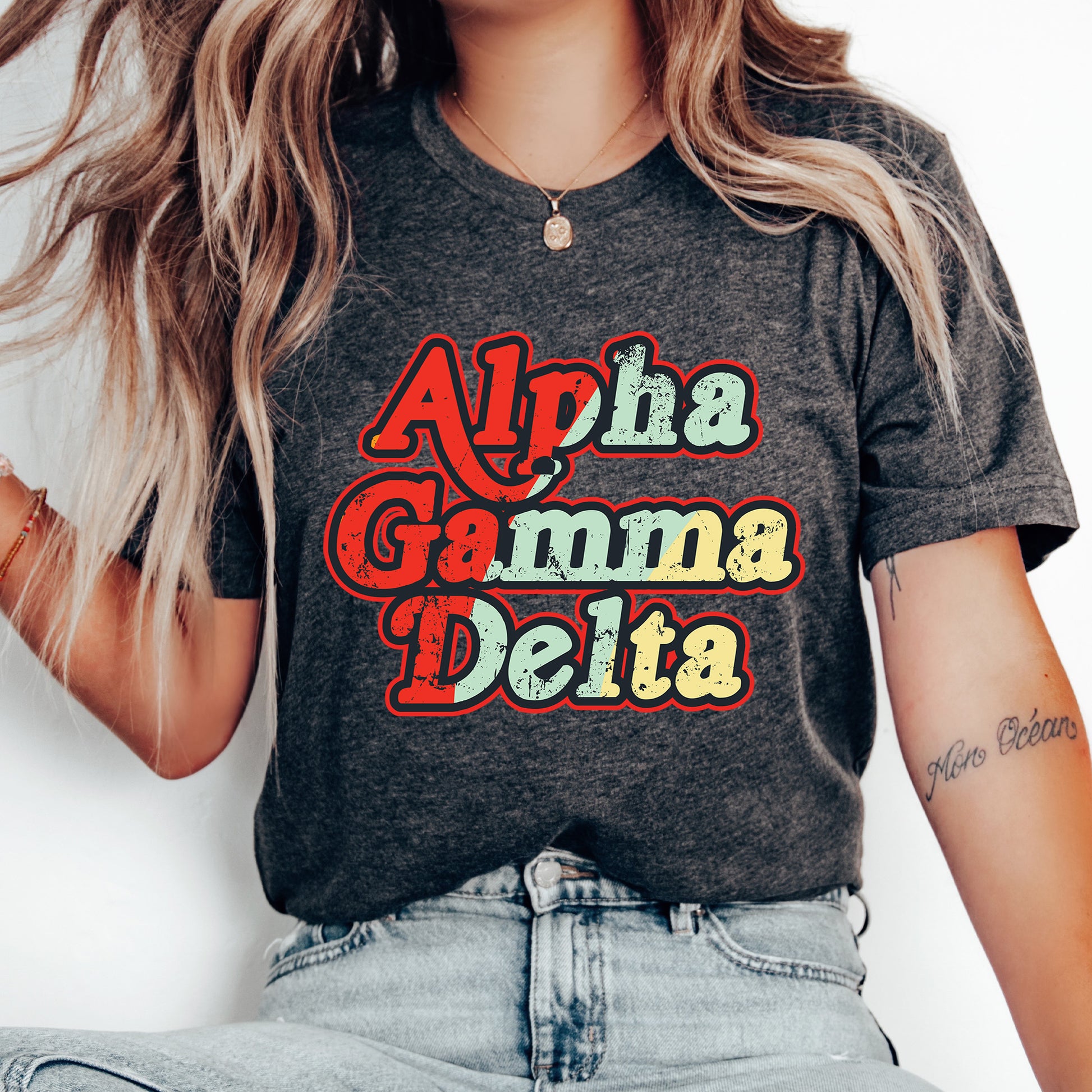 a woman wearing a shirt that says aloha gamma delta